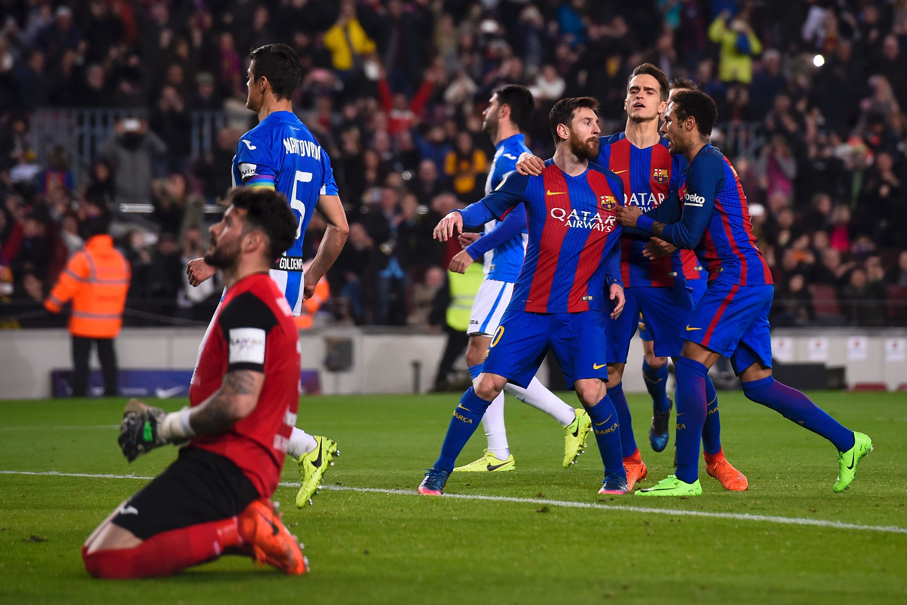 Barcelona's Argentinian forward Lionel Messi (3R) is congratulated by teammates Barcelona's Brazilian forward Neymar (R) and Barcelona's midfielder Denis Suarez (2R) after scoring a goal during the Spanish league football match FC Barcelona vs CD Leganes at the Camp Nou stadium in Barcelona on February 19, 2017. / AFP / Josep Lago (Photo credit should read JOSEP LAGO/AFP/Getty Images)