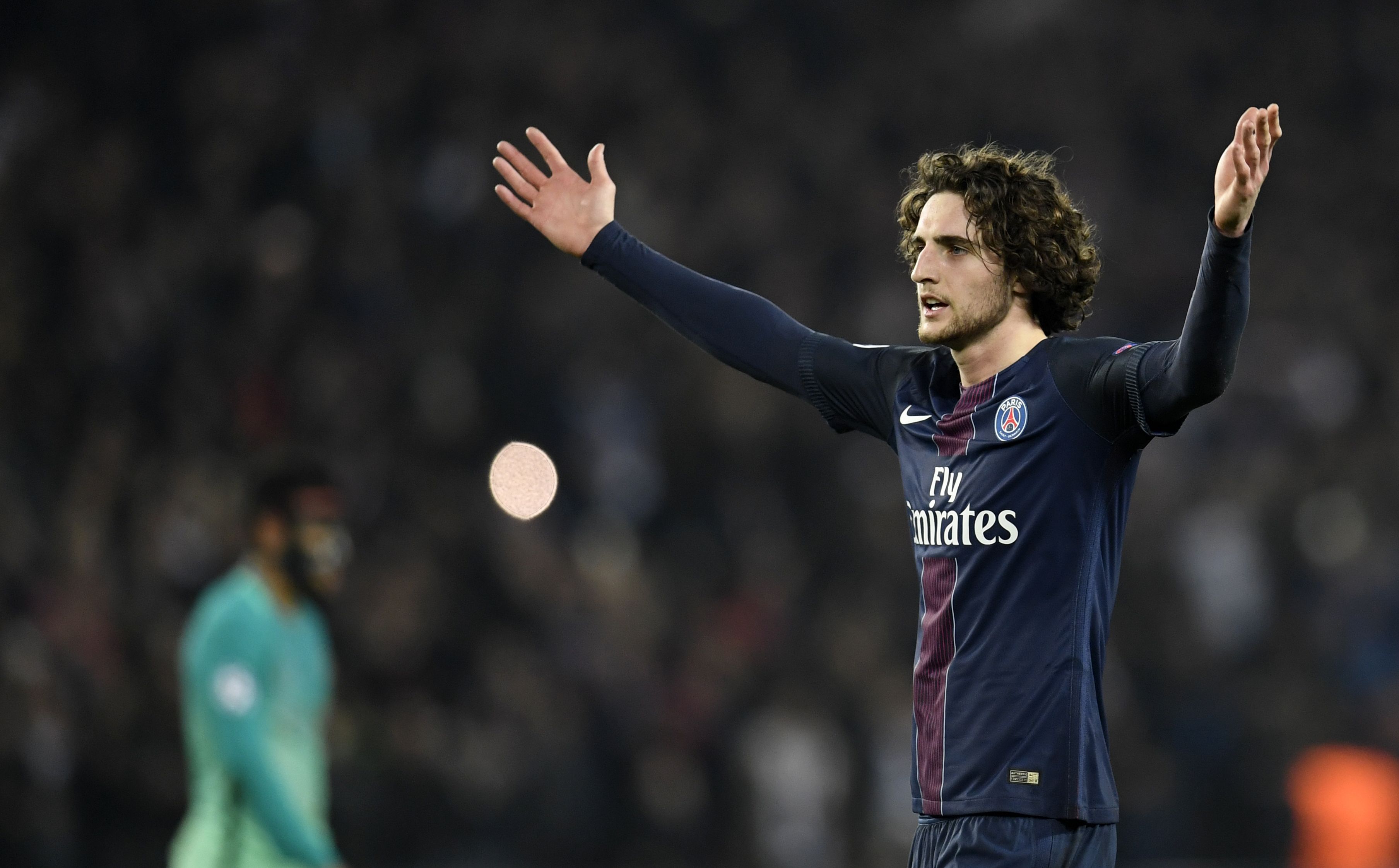Paris Saint-Germain's French midfielder Adrien Rabiot celebrates after Paris Saint-Germain's players won the UEFA Champions League round of 16 first leg football match between Paris Saint-Germain and FC Barcelona on February 14, 2017 at the Parc des Princes stadium in Paris. / AFP / CHRISTOPHE SIMON (Photo credit should read CHRISTOPHE SIMON/AFP/Getty Images)