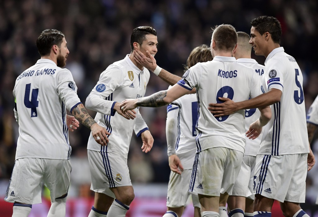 Real Madrid's Portuguese forward Cristiano Ronaldo (2L) and teammates celebrate their third goal during the UEFA Champions League round of 16 first leg football match Real Madrid CF vs SSC Napoli at the Santiago Bernabeu stadium in Madrid on February 15, 2017. / AFP / JAVIER SORIANO (Photo credit should read JAVIER SORIANO/AFP/Getty Images)