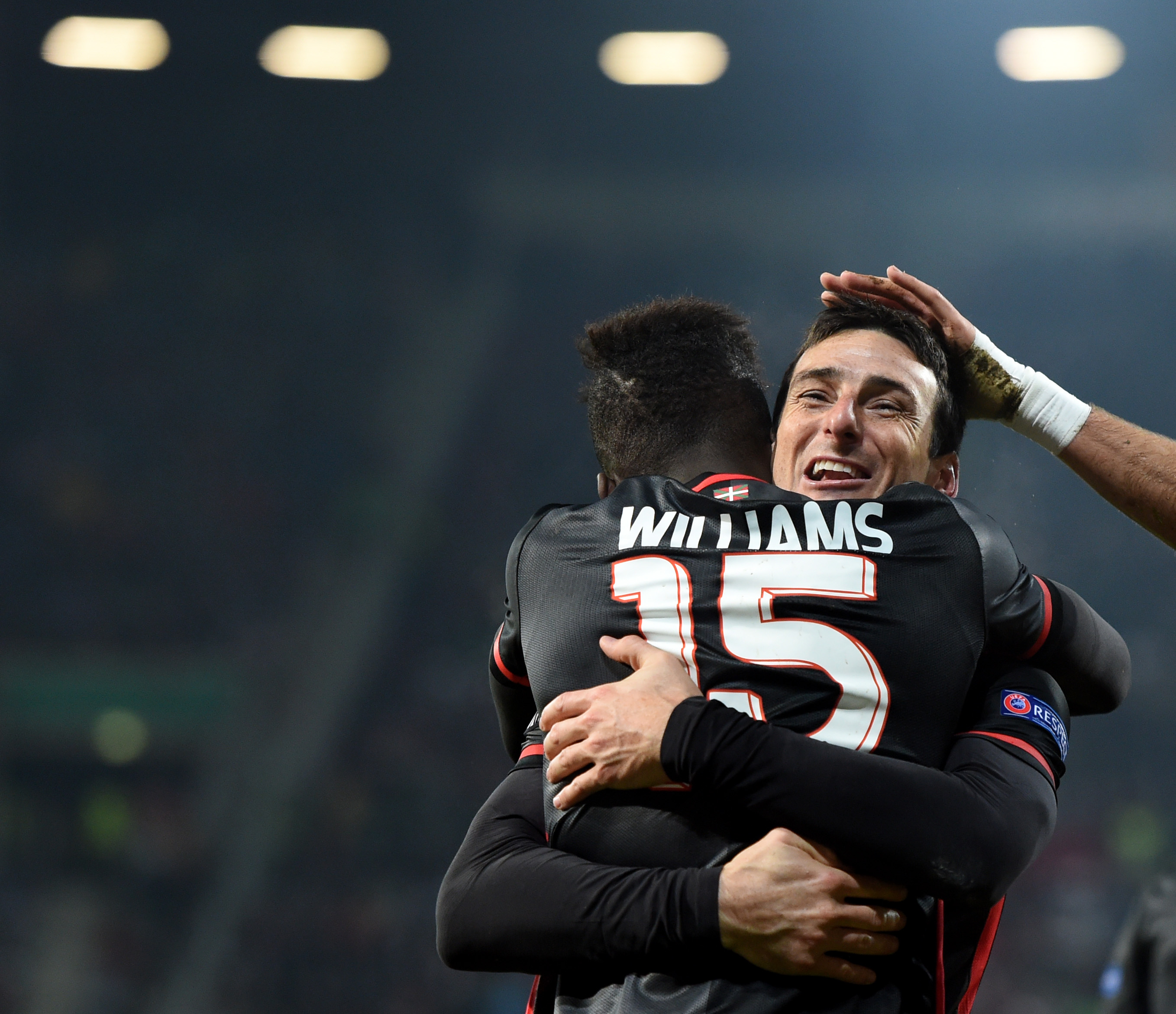 Bilbao's striker Aritz Aduriz (R) and his teammate Bilbao's striker Inaki Williams (L) celebrate after the third goal for Bilbao during the UEFA Europa League football match FC Augsburg v Athletic Club in Augsburg, southern Germany on November 26, 2015. AFP PHOTO / CHRISTOF STACHE / AFP / CHRISTOF STACHE (Photo credit should read CHRISTOF STACHE/AFP/Getty Images)