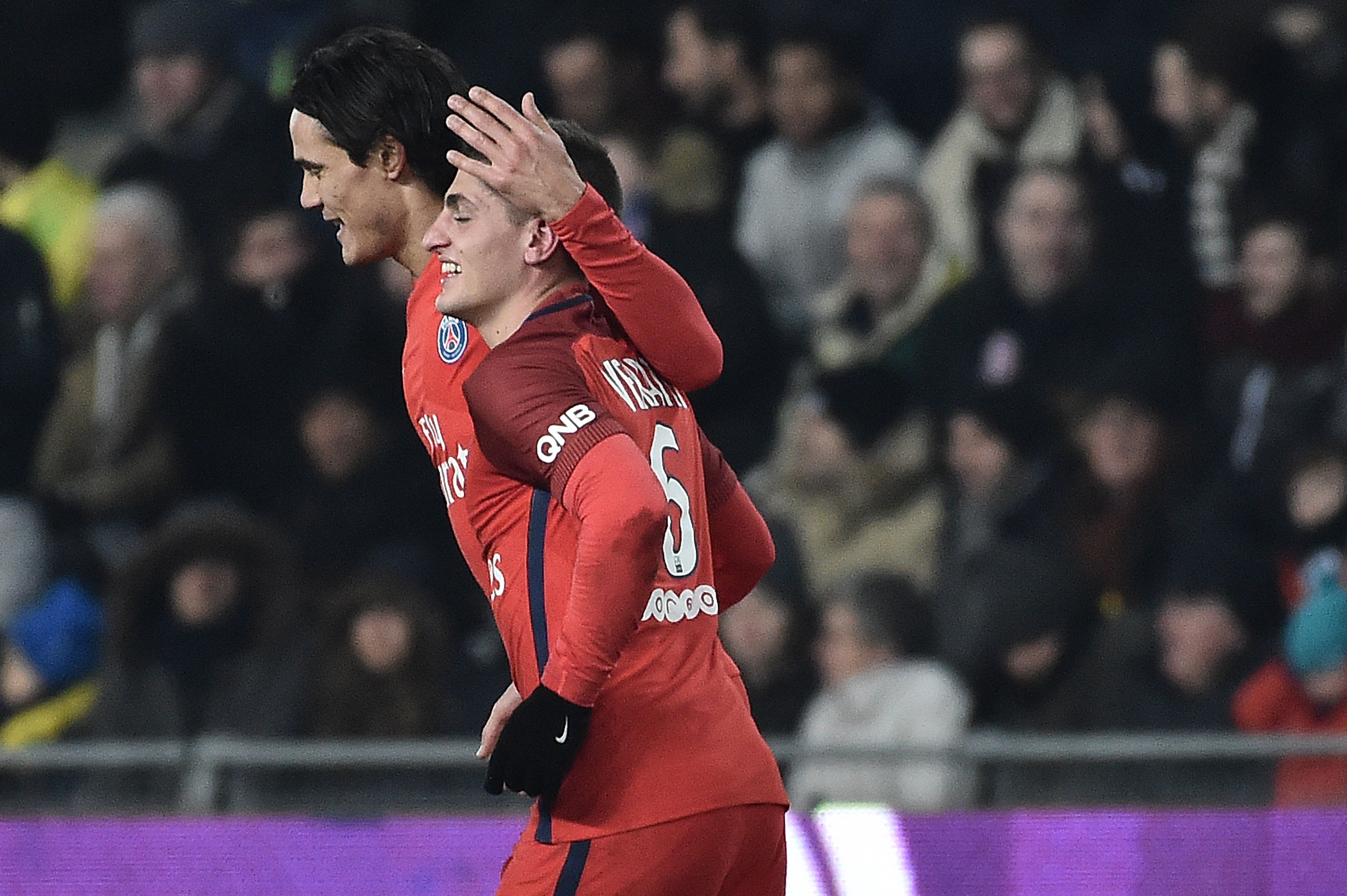 Paris Saint-Germain's Uruguayan forward Edinson Cavani (L) celebrates with Paris Saint-Germain's Italian midfielder Marco Verratti (C) after scoring a goal during the French L1 football match between Nantes and Paris Saint-Germain on January 21, 2017 at the Beaujoire stadium of Nantes, western France. / AFP / JEAN-SEBASTIEN EVRARD (Photo credit should read JEAN-SEBASTIEN EVRARD/AFP/Getty Images)