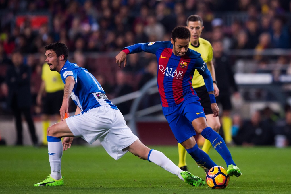 BARCELONA, SPAIN - FEBRUARY 19: Neymar Santos Jr of FC Barcelona dribbles past Erik Moran of CD Leganes during the La Liga match between FC Barcelona and CD Leganes at Camp Nou stadium on February 19, 2017 in Barcelona, Spain. (Photo by Alex Caparros/Getty Images)