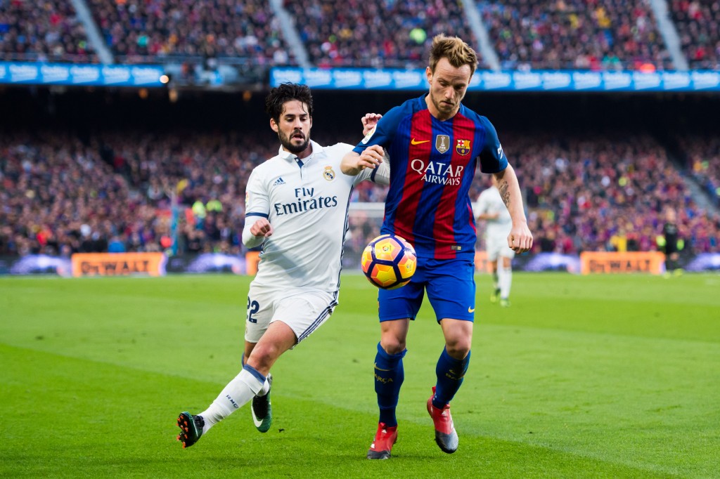 Could Isco and Rakitic be swapping shirts at the end of the season? (Photo courtesy - Alex Caparros/Getty Images)