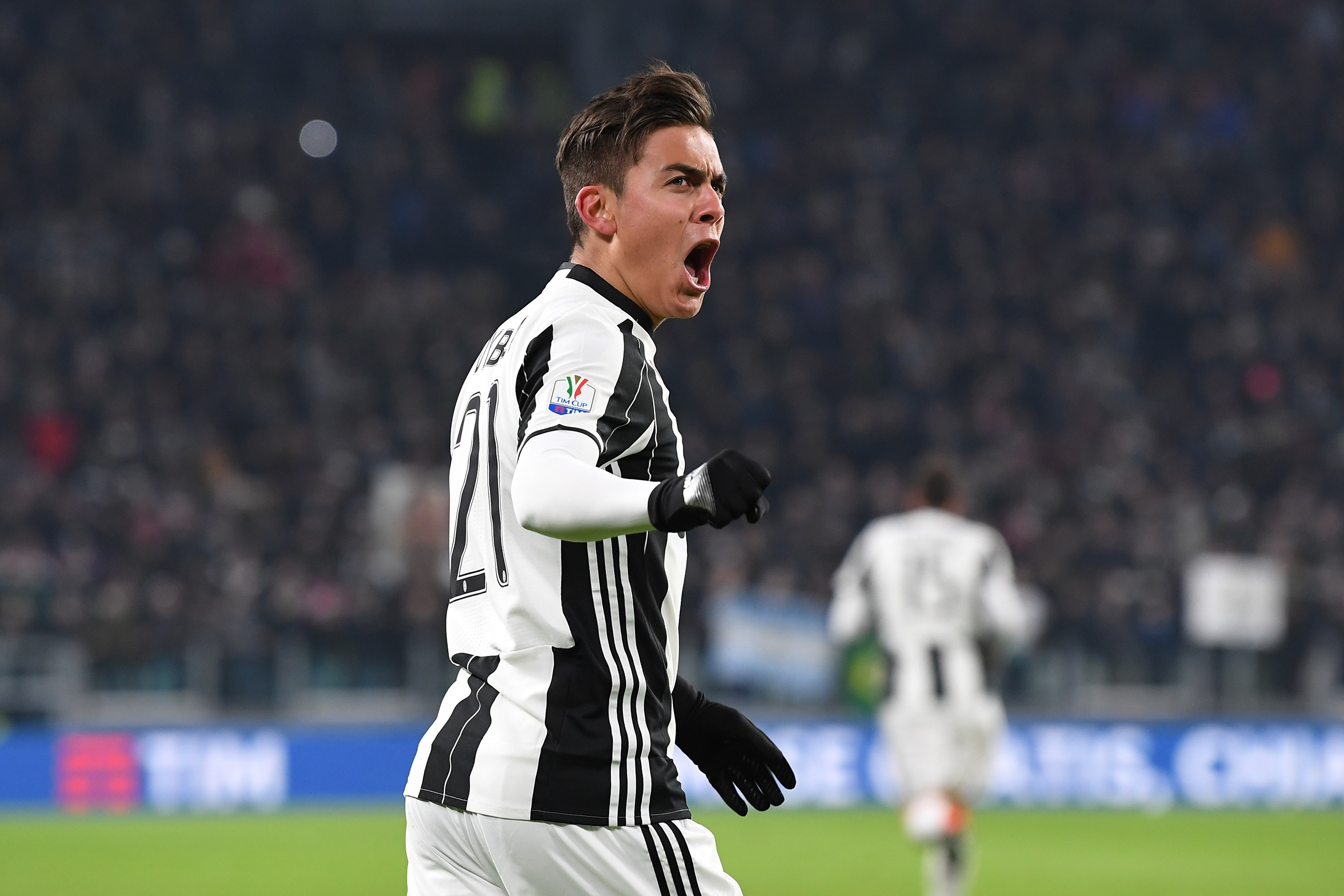 TURIN, ITALY - JANUARY 25: Paulo Dybala of Juventus FC celebrates after scoring the opening goal during the TIM Cup match between Juventus FC and AC Milan at Juventus Stadium on January 25, 2017 in Turin, Italy. (Photo by Valerio Pennicino/Getty Images)