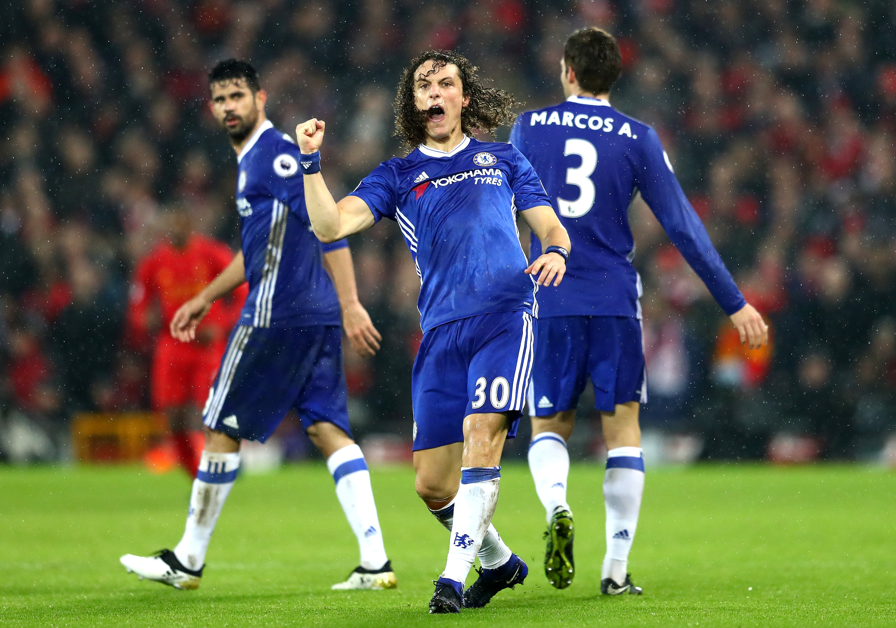 LIVERPOOL, ENGLAND - JANUARY 31: David Luiz (C) of Chelsea celebrates scoring the opening goal during the Premier League match between Liverpool and Chelsea at Anfield on January 31, 2017 in Liverpool, England. (Photo by Clive Mason/Getty Images)
