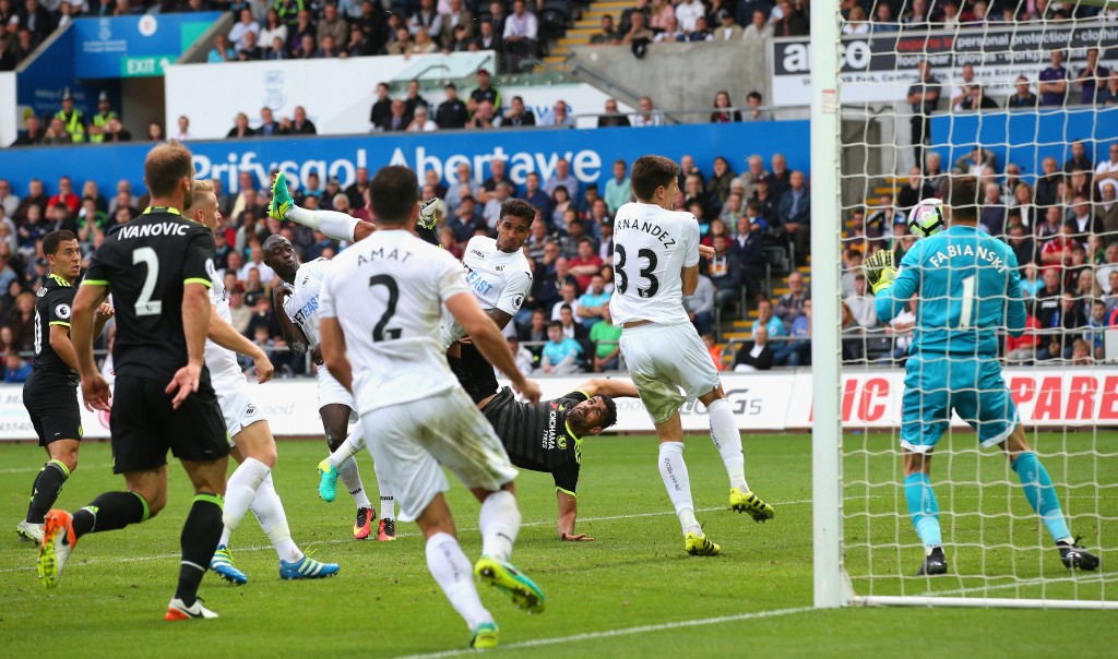 SWANSEA, WALES - SEPTEMBER 11: Diego Costa of Chelsea (C) scores their second goal during the Premier League match between Swansea City and Chelsea at Liberty Stadium on September 11, 2016 in Swansea, Wales. (Photo by Alex Livesey/Getty Images)