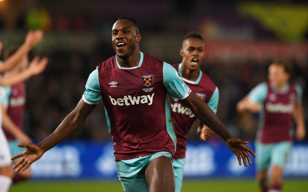 SWANSEA, WALES - DECEMBER 26: Michail Antonio of West Ham United celebrates scoring his team's third goal during the Premier League match between Swansea City and West Ham United at Liberty Stadium on December 26, 2016 in Swansea, Wales. (Photo by Stu Forster/Getty Images)