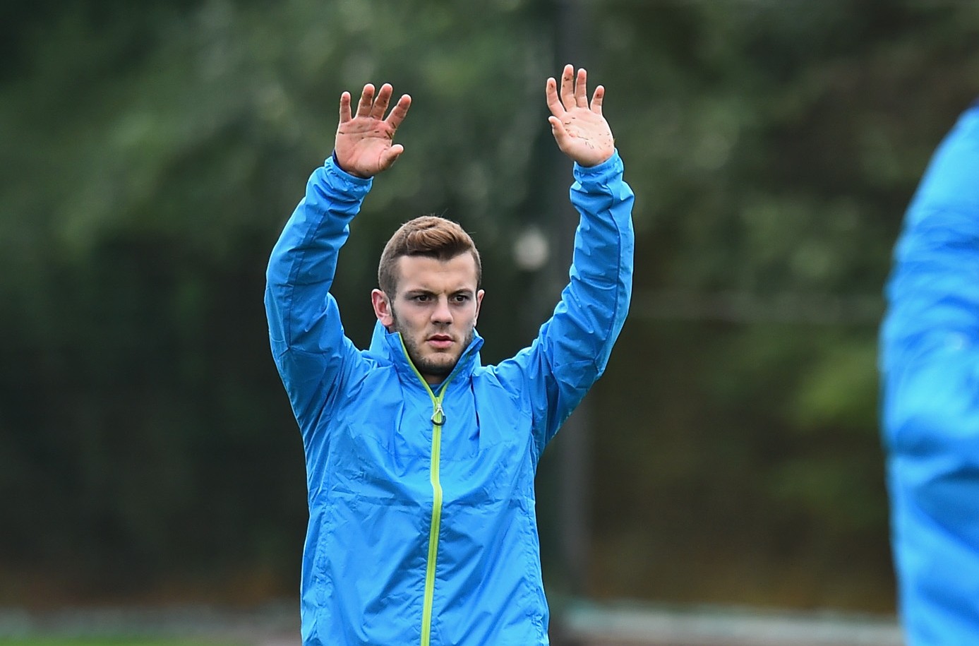 ST ALBANS, ENGLAND - AUGUST 26: Jack Wilshere and Alex Oxlade-Chamberlain of Arsenal warm-up during a training session at London Colney on August 26, 2014 in St Albans, England. (Photo by Shaun Botterill/Getty Images)