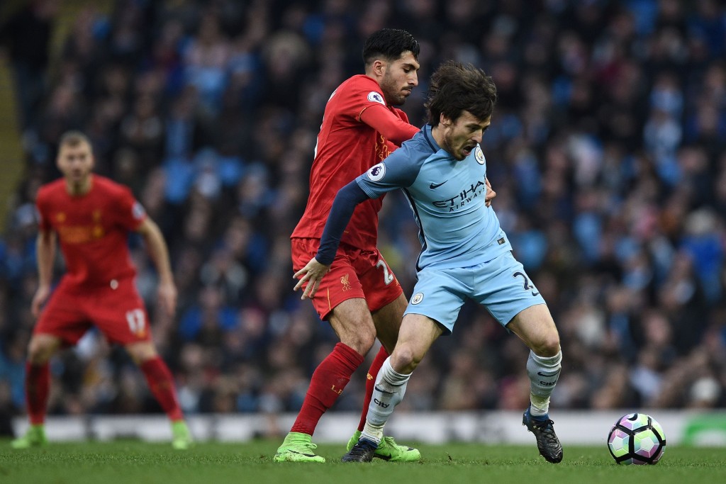 Liverpool's German midfielder Emre Can (2nd L) vies with Manchester City's Spanish midfielder David Silva during the English Premier League football match between Manchester City and Liverpool at the Etihad Stadium in Manchester, north west England, on March 19, 2017. / AFP PHOTO / Oli SCARFF / RESTRICTED TO EDITORIAL USE. No use with unauthorized audio, video, data, fixture lists, club/league logos or 'live' services. Online in-match use limited to 75 images, no video emulation. No use in betting, games or single club/league/player publications. / (Photo credit should read OLI SCARFF/AFP/Getty Images)