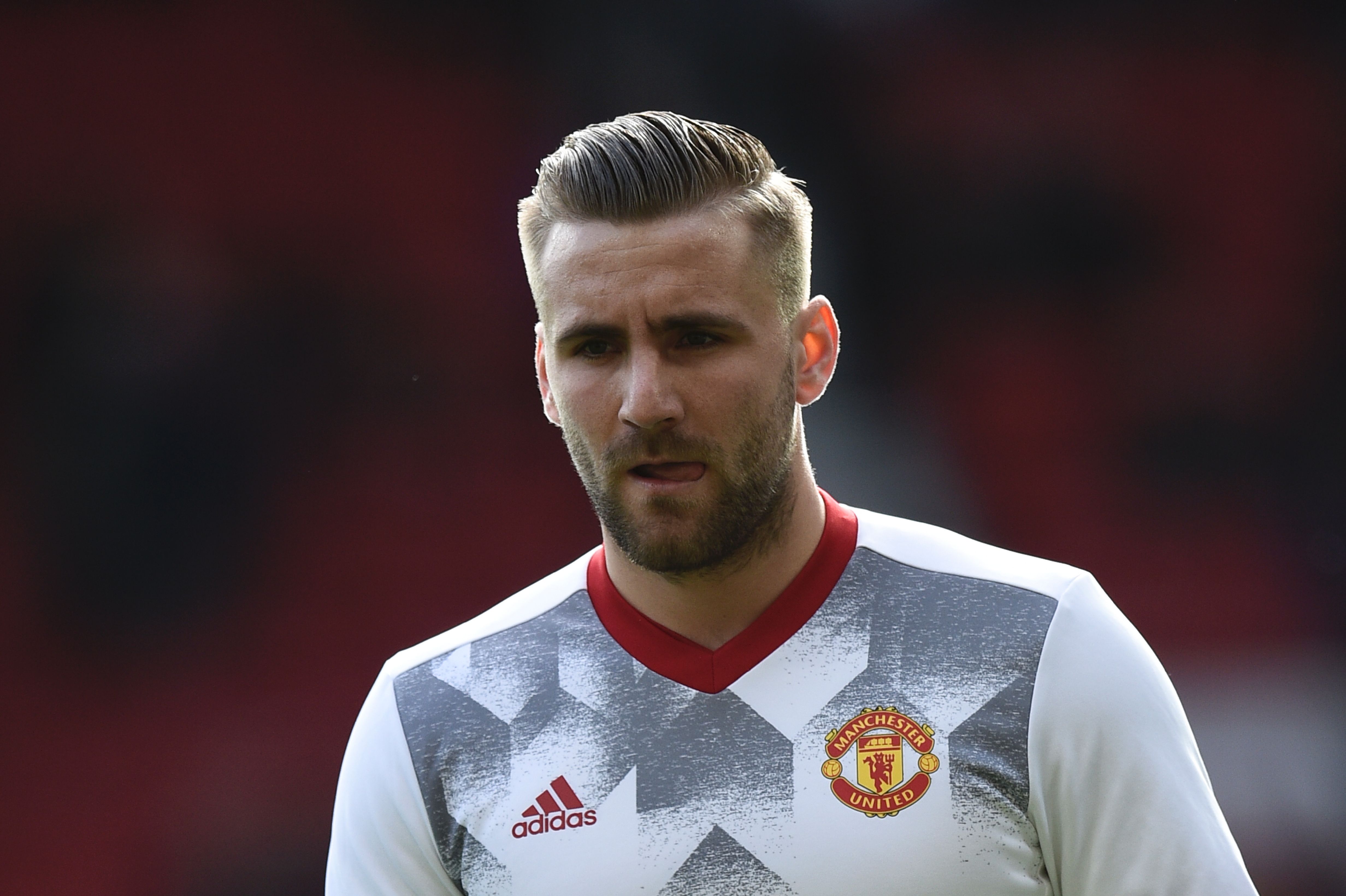 Manchester United's English defender Luke Shaw warms up before the English Premier League football match between Manchester United and Bournemouth at Old Trafford in Manchester, north west England, on March 4, 2017. / AFP PHOTO / Oli SCARFF / RESTRICTED TO EDITORIAL USE. No use with unauthorized audio, video, data, fixture lists, club/league logos or 'live' services. Online in-match use limited to 75 images, no video emulation. No use in betting, games or single club/league/player publications. / (Photo credit should read OLI SCARFF/AFP/Getty Images)
