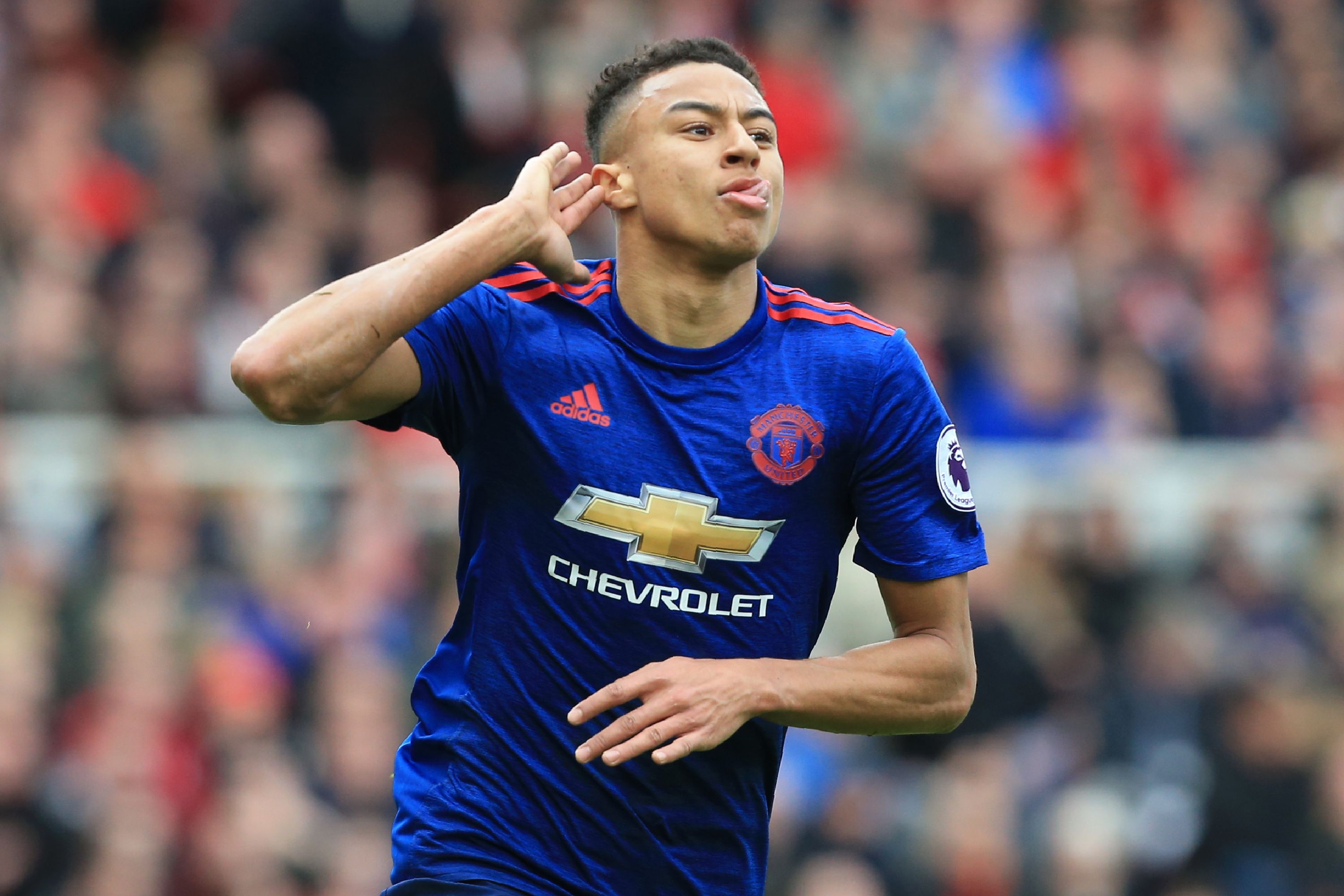 Manchester United's English midfielder Jesse Lingard celebrates after scoring their second goal during the English Premier League football match between Middlesbrough and Manchester United at Riverside Stadium in Middlesbrough, north east England on March 19, 2017. / AFP PHOTO / Lindsey PARNABY / RESTRICTED TO EDITORIAL USE. No use with unauthorized audio, video, data, fixture lists, club/league logos or 'live' services. Online in-match use limited to 75 images, no video emulation. No use in betting, games or single club/league/player publications. / (Photo credit should read LINDSEY PARNABY/AFP/Getty Images)