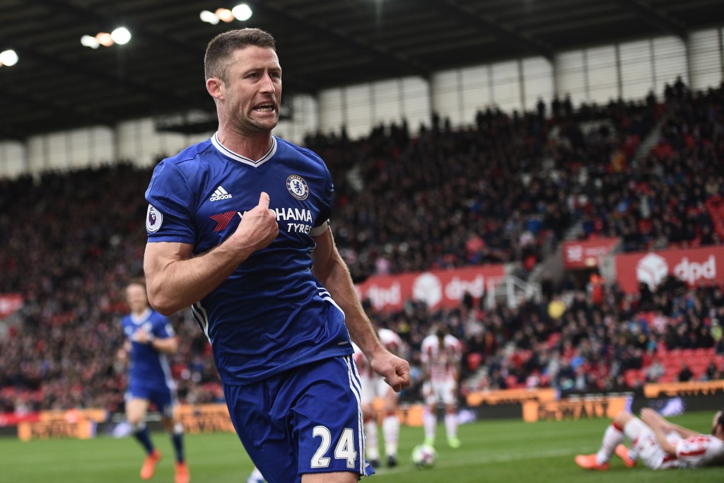 Chelsea's English defender Gary Cahill (C) celebrates after scoring their second goal during the English Premier League football match between Stoke City and Chelsea at the Bet365 Stadium in Stoke-on-Trent, central England on March 18, 2017. / AFP PHOTO / Oli SCARFF / RESTRICTED TO EDITORIAL USE. No use with unauthorized audio, video, data, fixture lists, club/league logos or 'live' services. Online in-match use limited to 75 images, no video emulation. No use in betting, games or single club/league/player publications. / (Photo credit should read OLI SCARFF/AFP/Getty Images)