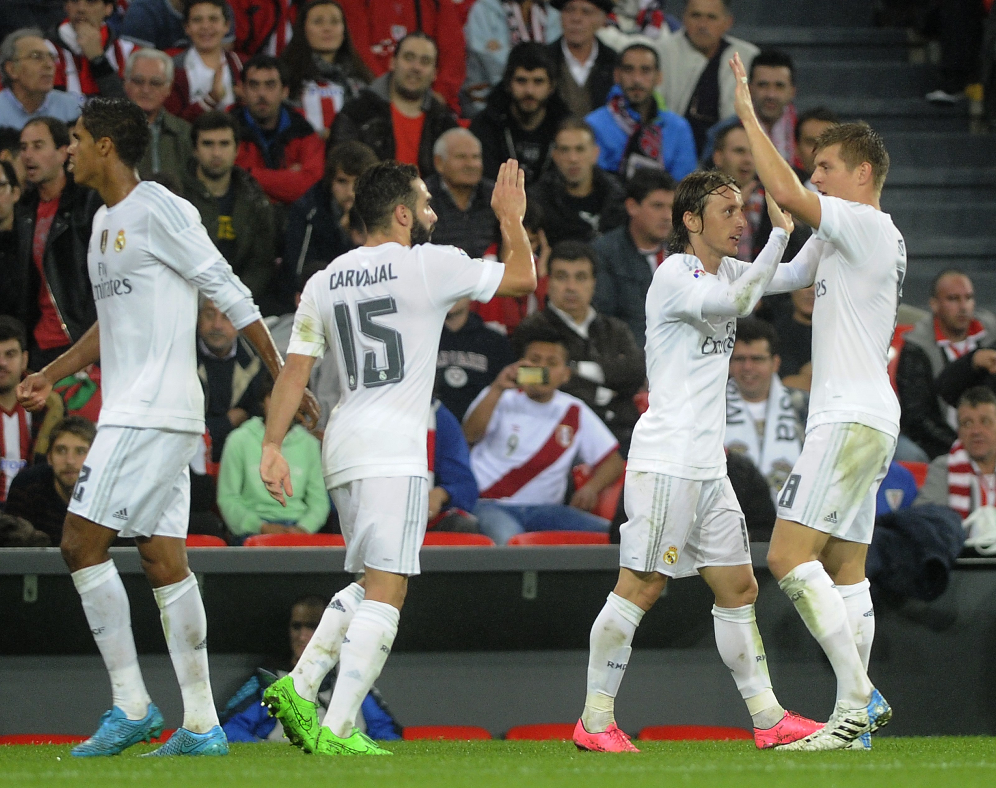 (From L to R) Real Madrid's French defender Raphael Varane, defender Daniel Carvajal, Croatian midfielder Luka Modric and German midfielder Toni Kroos celebrate after scoring during the Spanish league football match Athletic Club vs Real Madrid CF at the San Mames stadium in Bilbao on September 23, 2015. AFP PHOTO / ANDER GILLENEA (Photo credit should read ANDER GILLENEA/AFP/Getty Images)