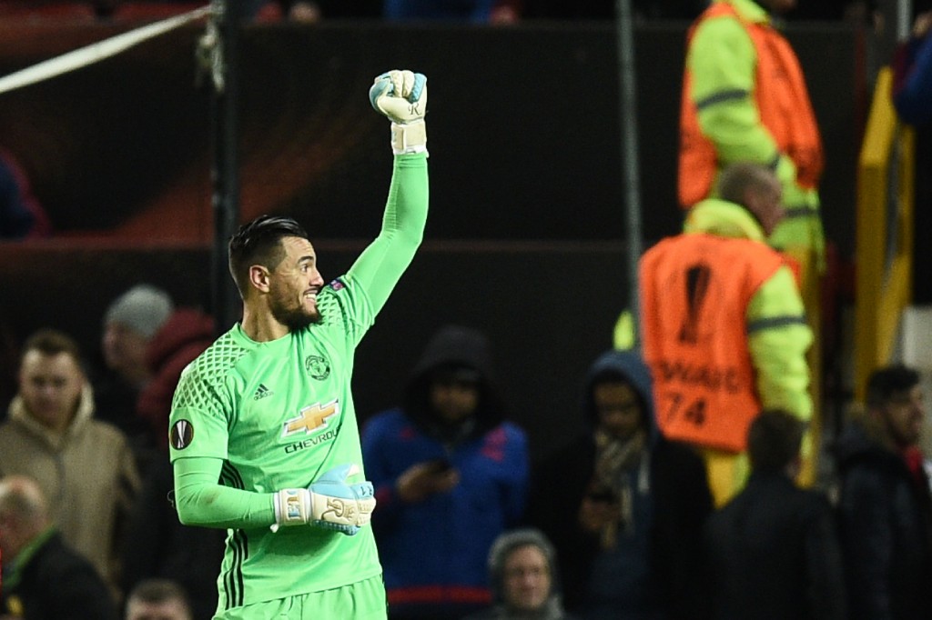 Manchester United's Argentinian goalkeeper Sergio Romero celebrates at the final whistle during the UEFA Europa League round of 16 second-leg football match between Manchester United and FC Rostov at Old Trafford stadium in Manchester, north-west England, on March 16, 2017. / AFP PHOTO / Oli SCARFF (Photo credit should read OLI SCARFF/AFP/Getty Images)