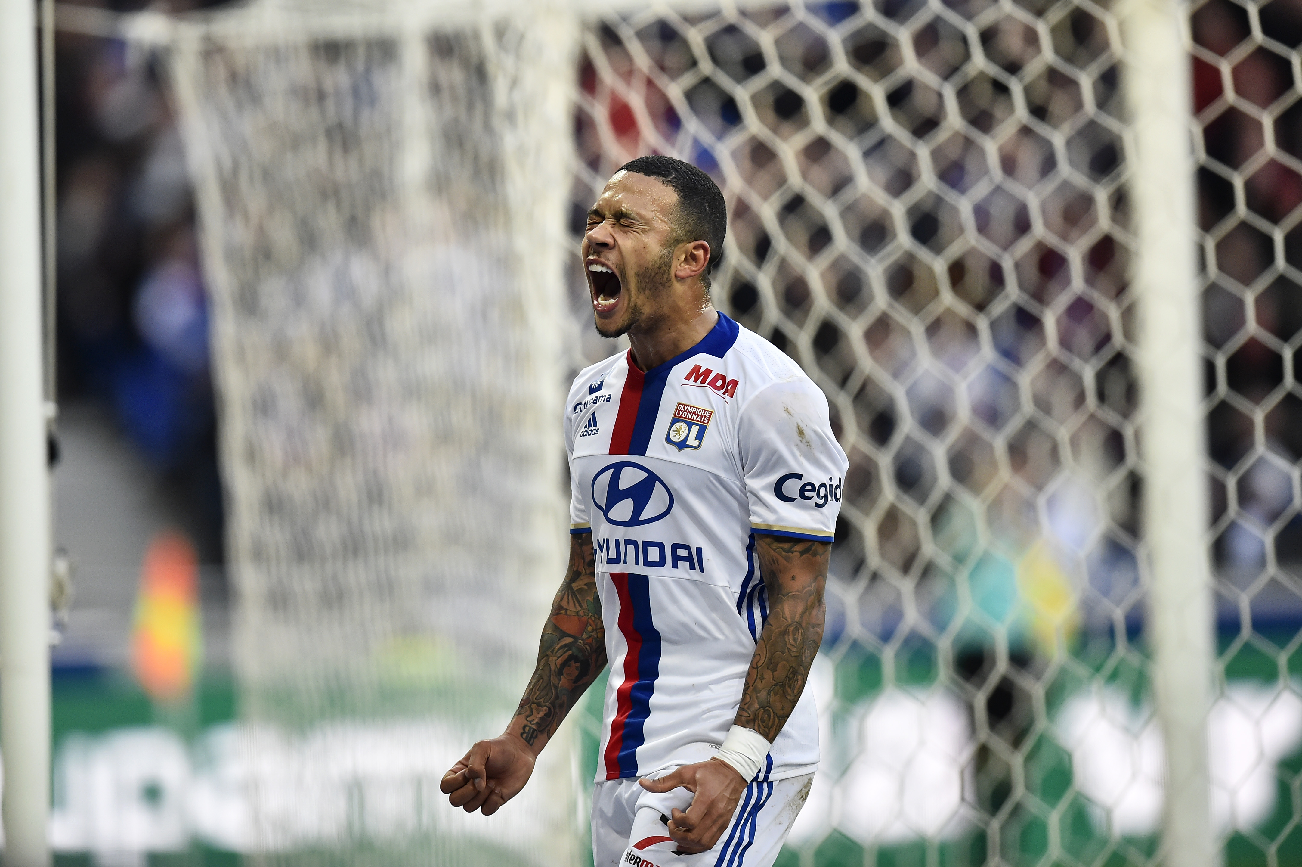 Lyon's Dutch forward Memphis Depay reacts during the French L1 football match between Olympique Lyonnais (OL) and Dijon (DFCO) on February 19, 2017, at the Parc Olympique Lyonnais stadium in Decines-Charpieu near Lyon, central-eastern France. / AFP / ROMAIN LAFABREGUE (Photo credit should read ROMAIN LAFABREGUE/AFP/Getty Images)