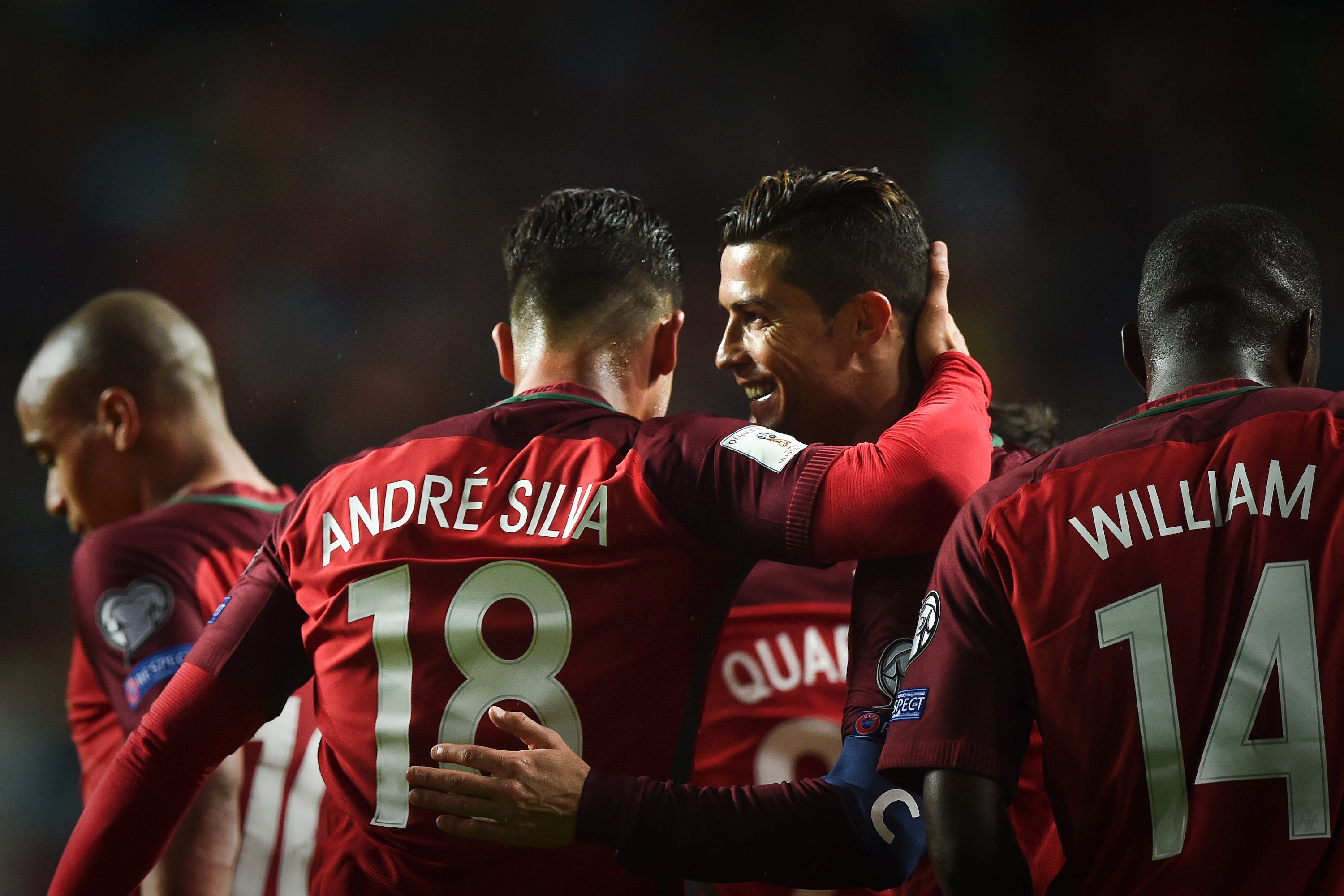 Portugal's forward Cristiano Ronaldo (2R) celebrates with his teammate Portugal's forward Andre Silva (2L) after scoring during the WC 2018 group B football qualifing match Portugal vs Hungary at the Luz stadium in Lisbon on March 25, 2017. / AFP PHOTO / PATRICIA DE MELO MOREIRA (Photo credit should read PATRICIA DE MELO MOREIRA/AFP/Getty Images)