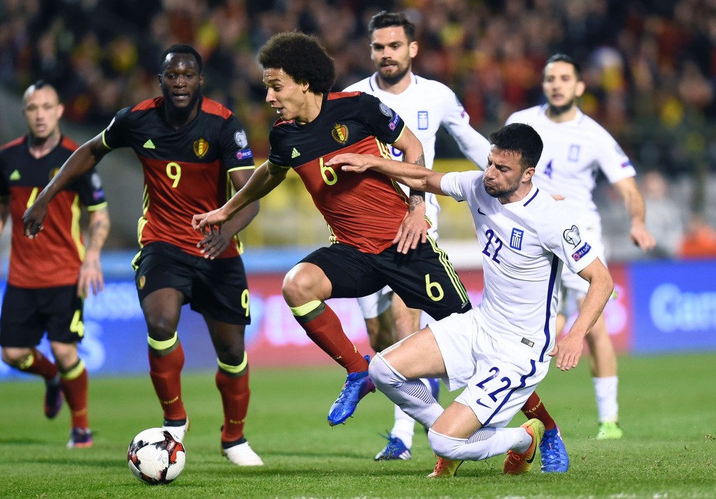 Belgium's midfielder Axel Witsel (C) vies with Greece's Andreas Samaris (R) during the FIFA World Cup 2018 qualification football match between Belgium and Greece, at the King Baudouin Stadium, on March 25, 2017 in Brussels. / AFP PHOTO / JOHN THYS (Photo credit should read JOHN THYS/AFP/Getty Images)