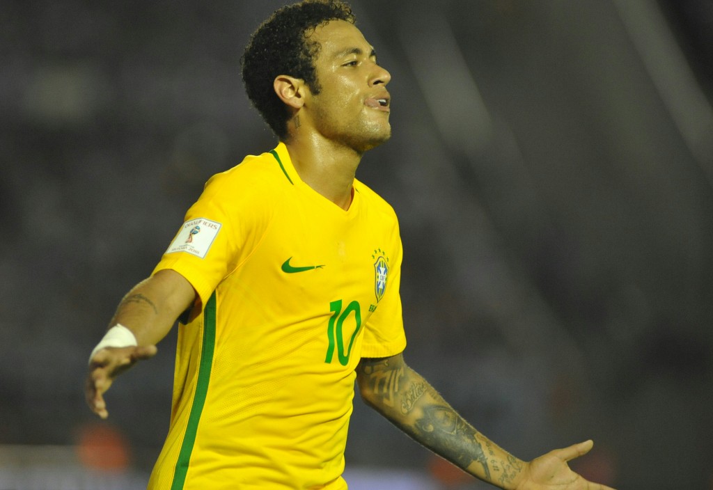 Brazil's Neymar celebrates his goal during their 2018 FIFA World Cup qualifier football match against Uruguay at the Centenario stadium in Montevideo, on March 23, 2017. / AFP PHOTO / DANTE FERNANDEZ (Photo credit should read DANTE FERNANDEZ/AFP/Getty Images)