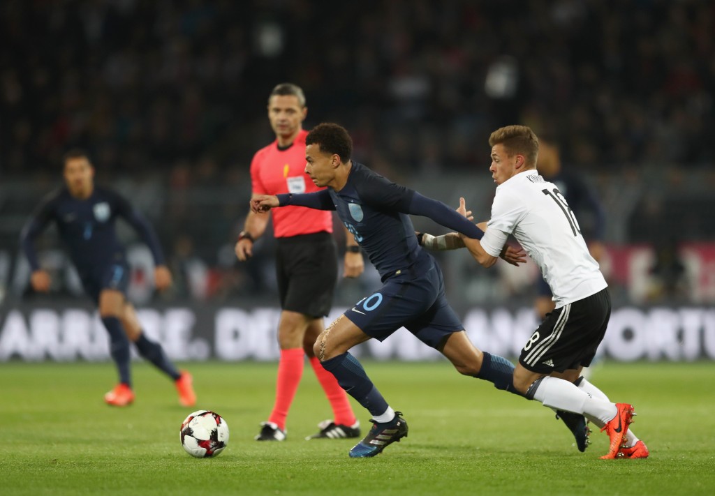 DORTMUND, GERMANY - MARCH 22: Dele Alli of England (L) is put under pressure from Joshua Kimmich of Germany (R) during the international friendly match between Germany and England at Signal Iduna Park on March 22, 2017 in Dortmund, Germany. (Photo by Lars Baron/Bongarts/Getty Images)