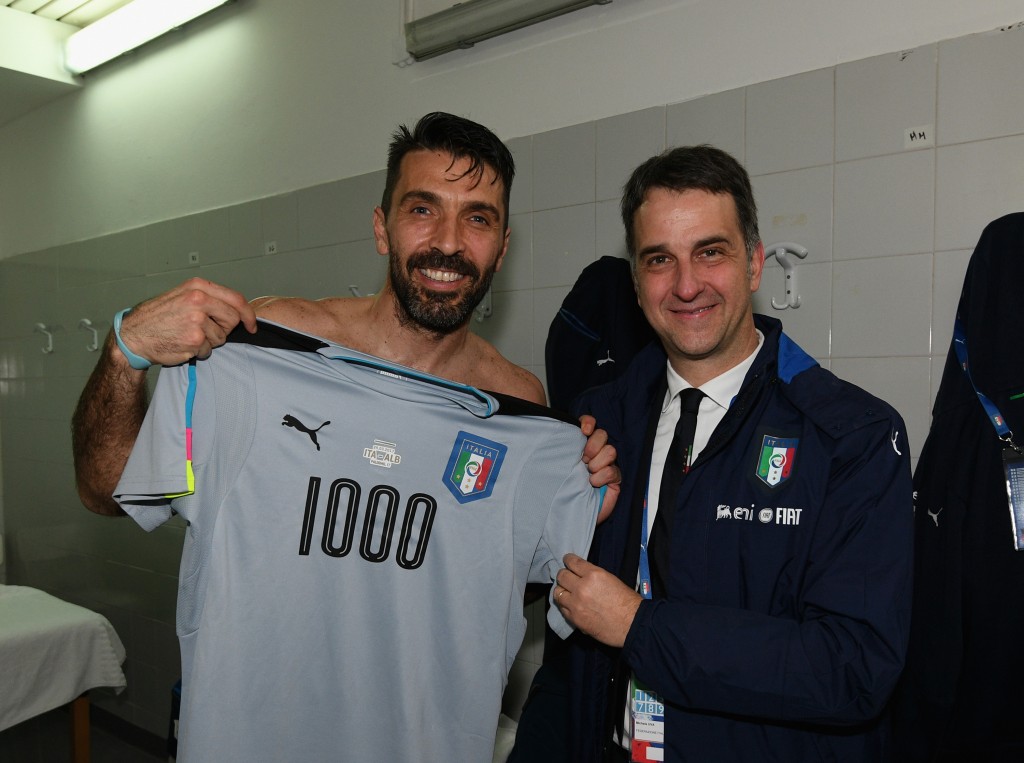 PALERMO, ITALY - MARCH 24: Gianluigi Buffon of Italy with a team jersey celebrating his 1000 career appearances with CEO of Italian Football Association Michele Uva after the FIFA 2018 World Cup Qualifier between Italy and Albania at Stadio Renzo Barbera on March 24, 2017 in Palermo, Italy. (Photo by Claudio Villa/Getty Images)