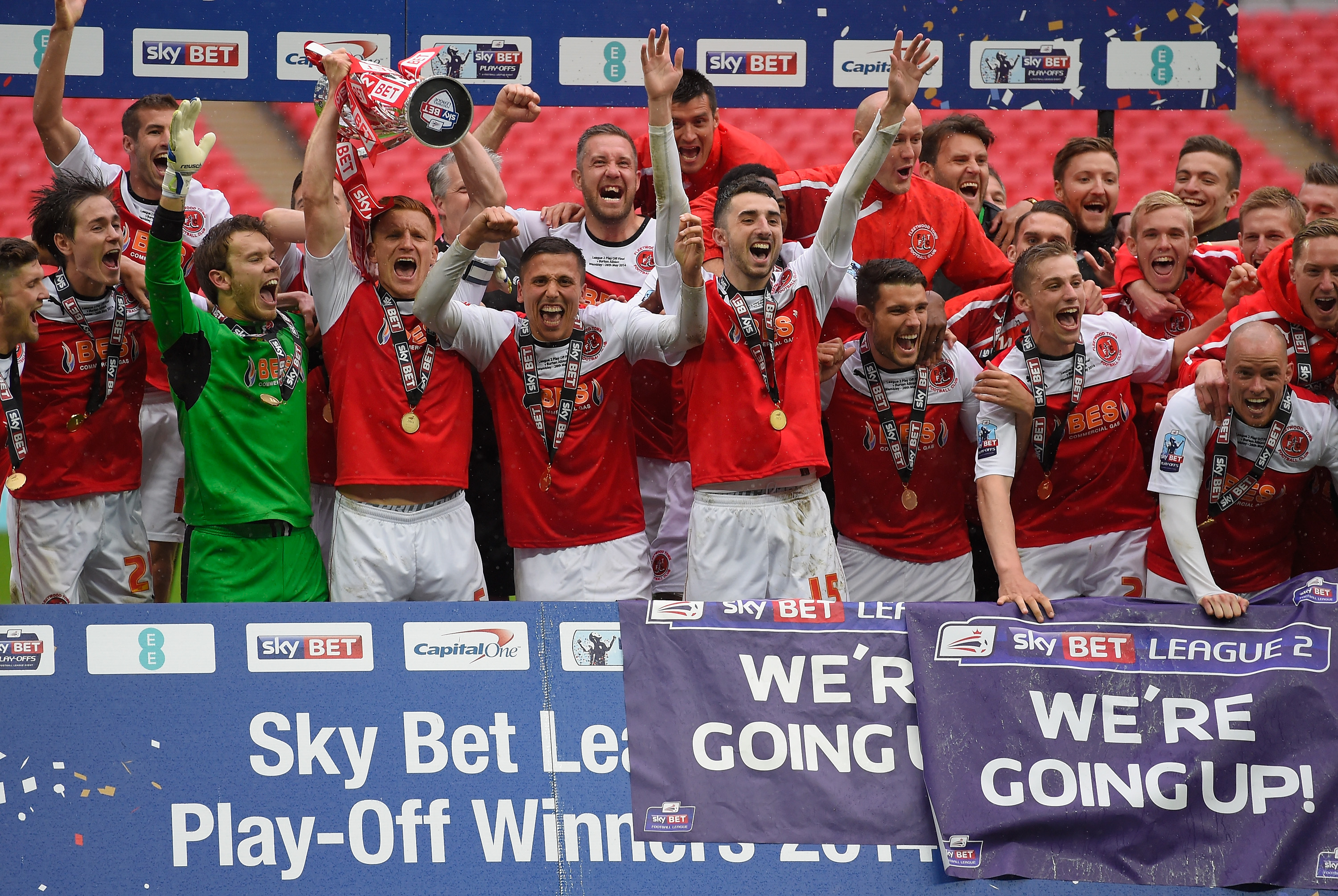 LONDON, ENGLAND - MAY 26: Fleetwood players celebrate promotion from Division 2 after the Sky Bet League Two Playoff Final between Burton Albion and Fleetwood Town at Wembley Stadium on May 26, 2014 in London, England. (Photo by Mike Hewitt/Getty Images)