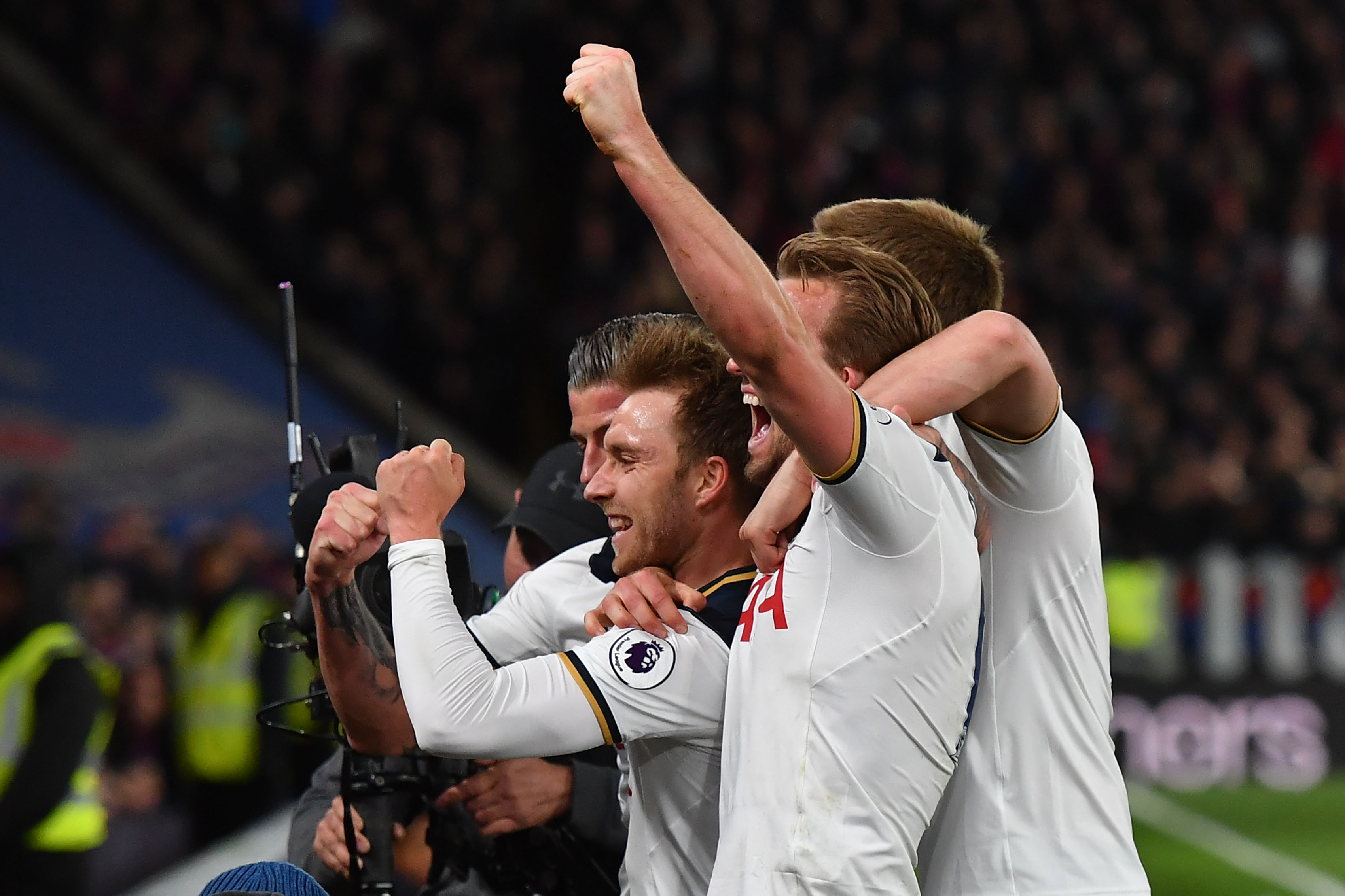 Tottenham Hotspur's Danish midfielder Christian Eriksen (L) celebrates scoring the opening goal with teammates during the English Premier League football match between Crystal Palace and Tottenham Hotspur at Selhurst Park in south London on April 26, 2017. / AFP PHOTO / Ben STANSALL / RESTRICTED TO EDITORIAL USE. No use with unauthorized audio, video, data, fixture lists, club/league logos or 'live' services. Online in-match use limited to 75 images, no video emulation. No use in betting, games or single club/league/player publications. / (Photo credit should read BEN STANSALL/AFP/Getty Images)