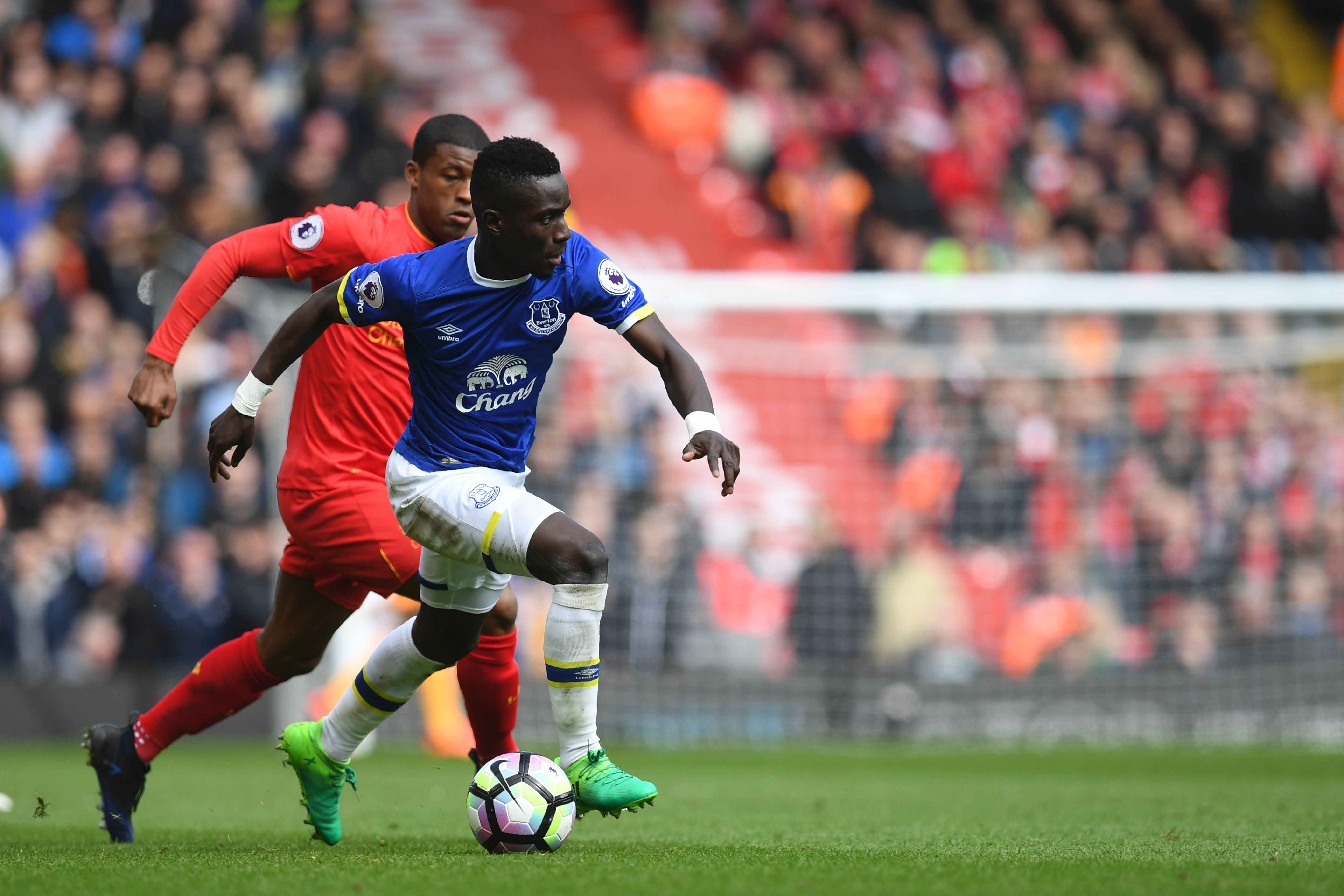 Everton's Senegalese midfielder Idrissa Gueye (R) vies with Liverpool's Dutch midfielder Georginio Wijnaldum during the English Premier League football match between Liverpool and Everton at Anfield in Liverpool, north west England on April 1, 2017. / AFP PHOTO / Paul ELLIS / RESTRICTED TO EDITORIAL USE. No use with unauthorized audio, video, data, fixture lists, club/league logos or 'live' services. Online in-match use limited to 75 images, no video emulation. No use in betting, games or single club/league/player publications. / (Photo credit should read PAUL ELLIS/AFP/Getty Images)