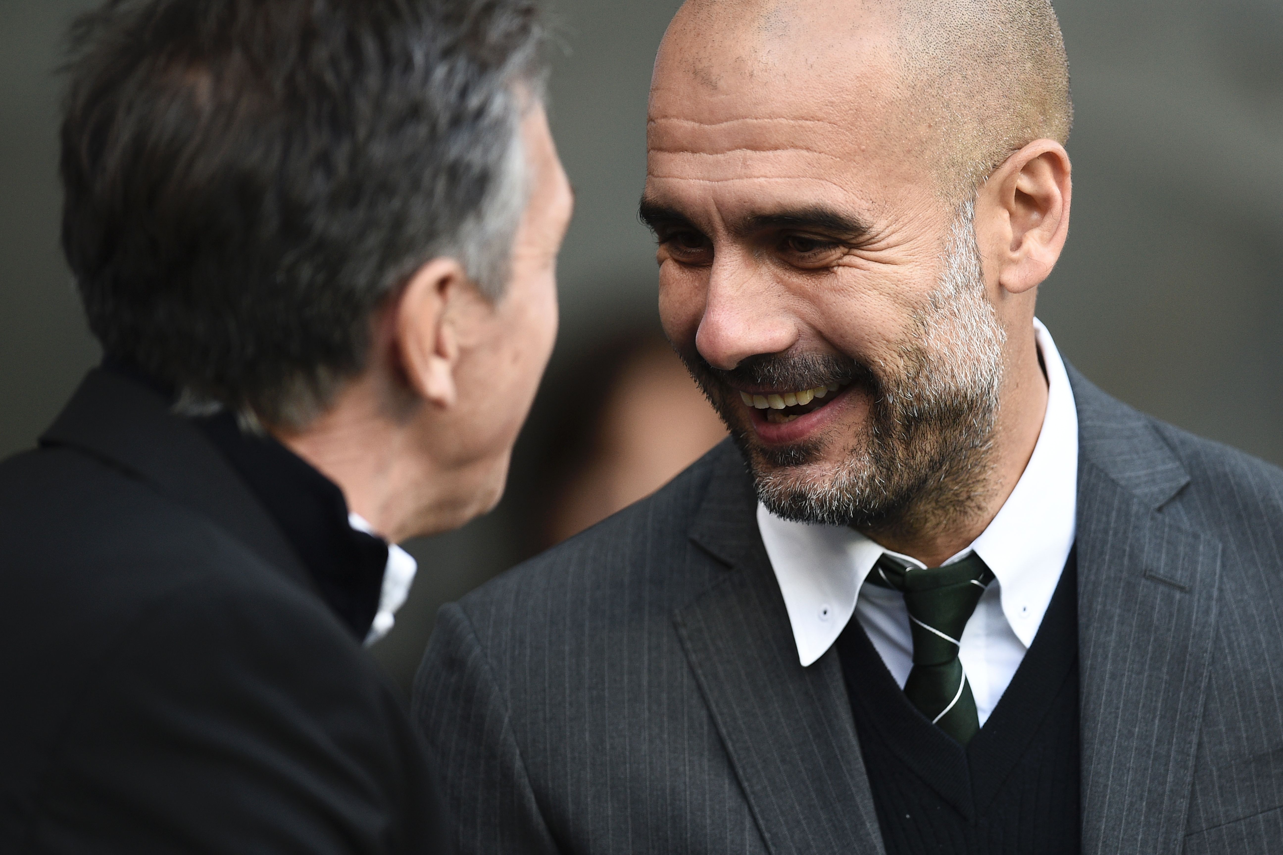 Manchester City's Spanish manager Pep Guardiola (R) greets Southampton's French manager Claude Puel ahead of the English Premier League football match between Manchester City and Southampton at the Etihad Stadium in Manchester, north west England, on October 23, 2016. / AFP / Oli SCARFF / RESTRICTED TO EDITORIAL USE. No use with unauthorized audio, video, data, fixture lists, club/league logos or 'live' services. Online in-match use limited to 75 images, no video emulation. No use in betting, games or single club/league/player publications. / (Photo credit should read OLI SCARFF/AFP/Getty Images)