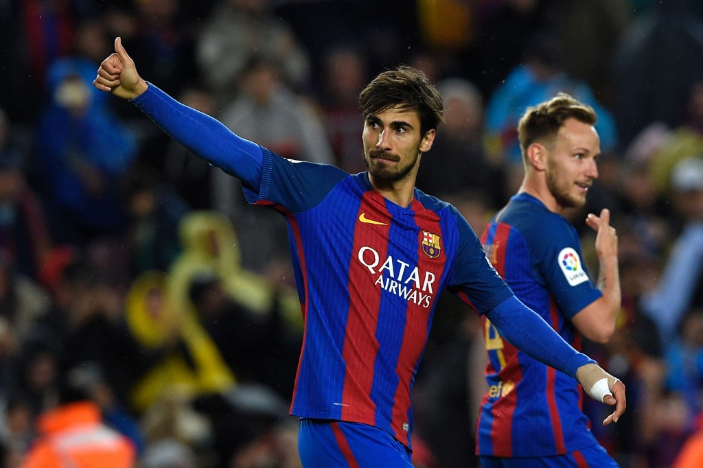 Barcelona's Portuguese midfielder Andre Gomes (L) celebrates after scoring a goal during the Spanish league football match FC Barcelona vs CA Osasuna at the Camp Nou stadium in Barcelona on April 26, 2017. / AFP PHOTO / LLUIS GENE (Photo credit should read LLUIS GENE/AFP/Getty Images)