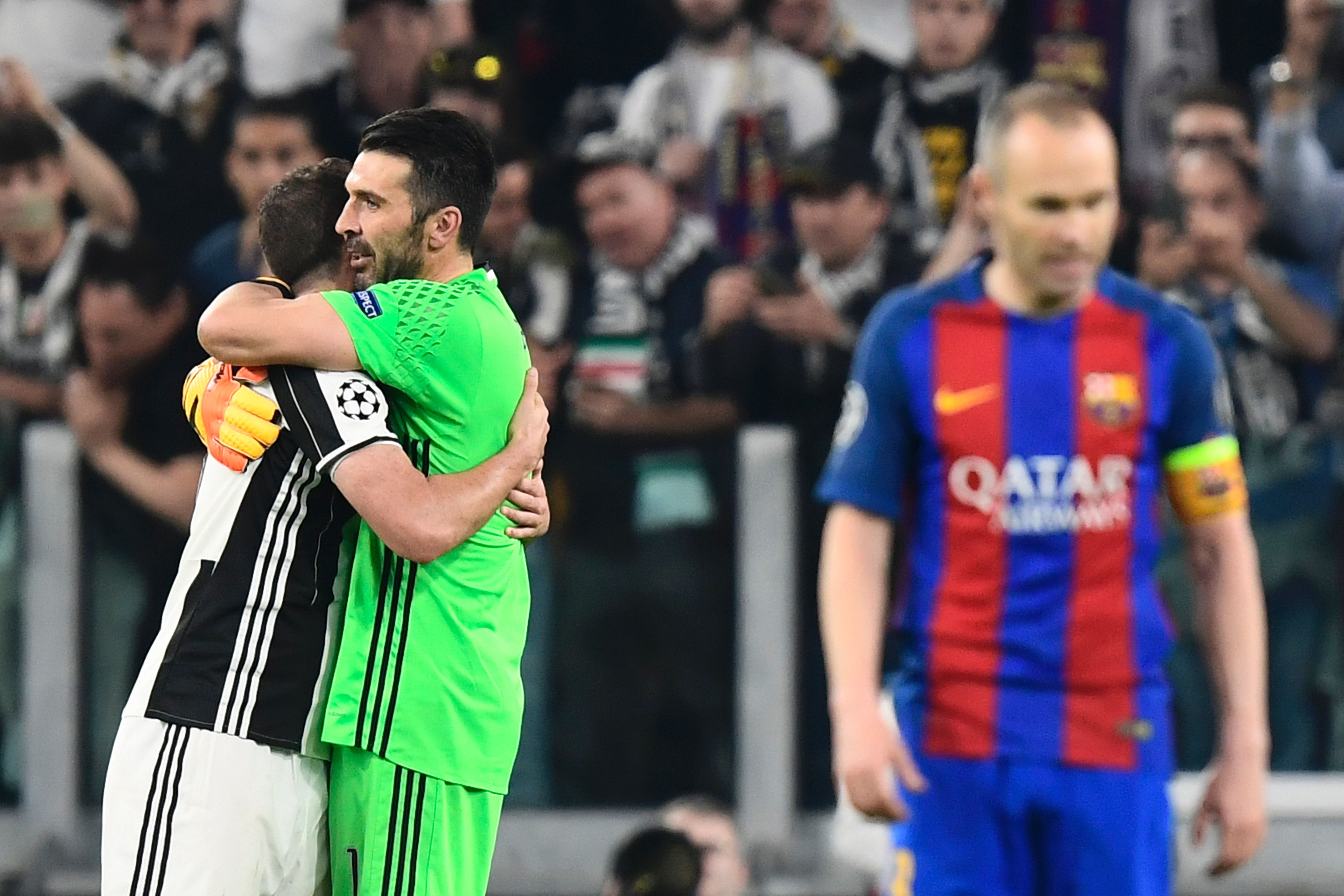 Juventus' goalkeeper from Italy Gianluigi Buffon and Juventus' forward from Argentina Gonzalo Higuain (L) celebrate after winning the UEFA Champions League quarter final first leg football match Juventus vs Barcelona, on April 11, 2017 at the Juventus stadium in Turin. Juventus won 3-0. / AFP PHOTO / MIGUEL MEDINA        (Photo credit should read MIGUEL MEDINA/AFP/Getty Images)