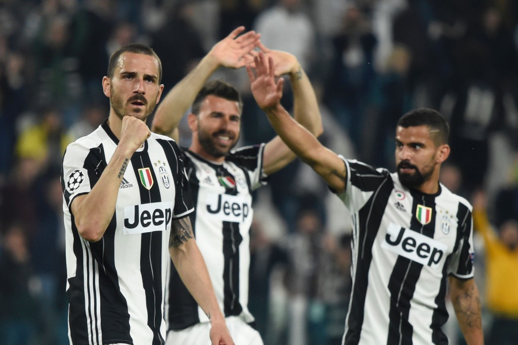 Juventus' defender from Italy Leonardo Bonucci (L), Juventus' defender from Italy Andrea Barzagli and Juventus midfielder from Venezuela Tomas Rincon celebrate after winning the UEFA Champions League quarter final first leg football match Juventus vs Barcelona, on April 11, 2017 at the Juventus stadium in Turin. Juventus won 3-0. / AFP PHOTO / Miguel MEDINA (Photo credit should read MIGUEL MEDINA/AFP/Getty Images)