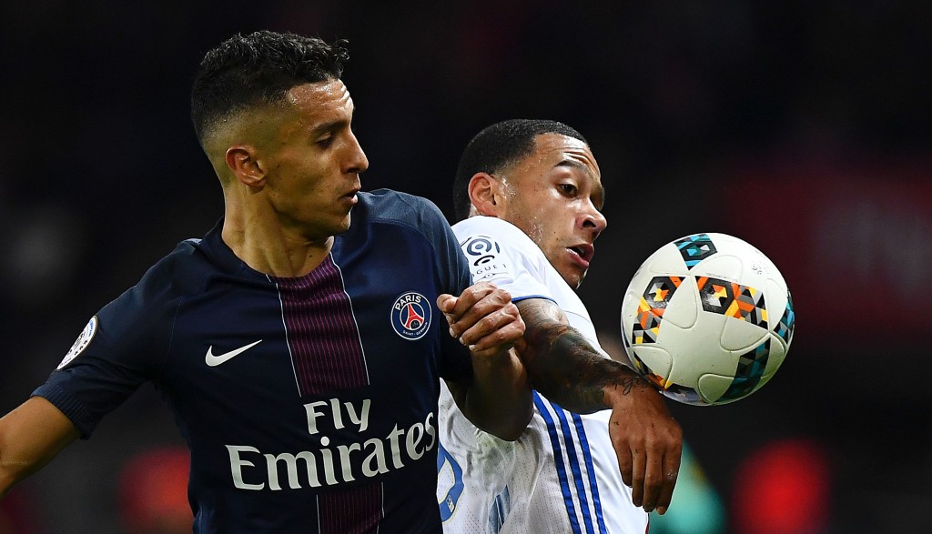 Paris Saint-Germain's Brazilian defender Marquinhos (L) and Lyon's Dutch forward Memphis Depay eye the ball during the French L1 football match Paris Saint-Germain (PSG) vs Olympique Lyonnais (OL) at the Parc des Princes stadium in Paris on March 19, 2017.  / AFP PHOTO / FRANCK FIFE        (Photo credit should read FRANCK FIFE/AFP/Getty Images)