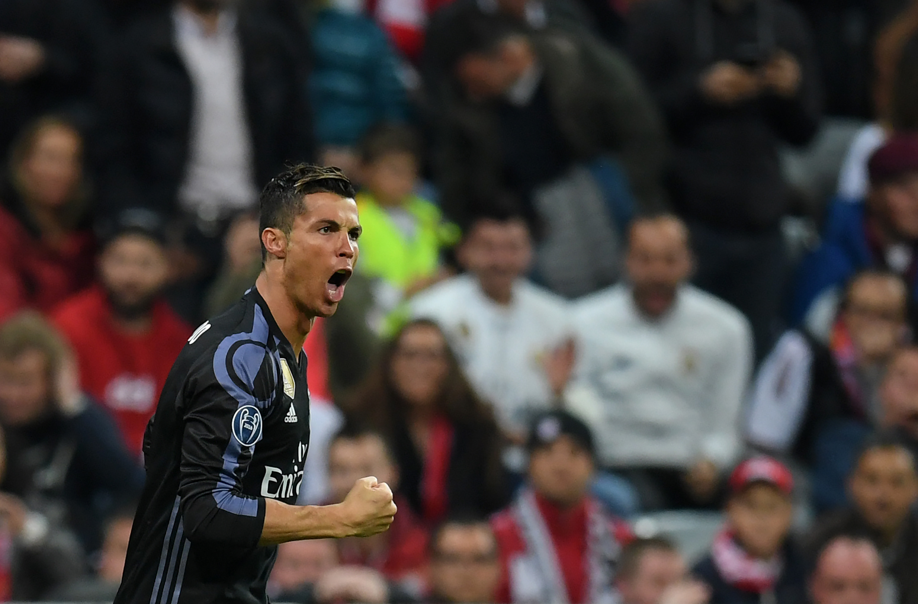 MUNICH, GERMANY - APRIL 12: Cristiano Ronaldo of Real Madrid celebrates after scoring his team's first goal during the UEFA Champions League Quarter Final first leg match between FC Bayern Muenchen and Real Madrid CF at Allianz Arena on April 12, 2017 in Munich, Germany. (Photo by Matthias Hangst/Bongarts/Getty Images)