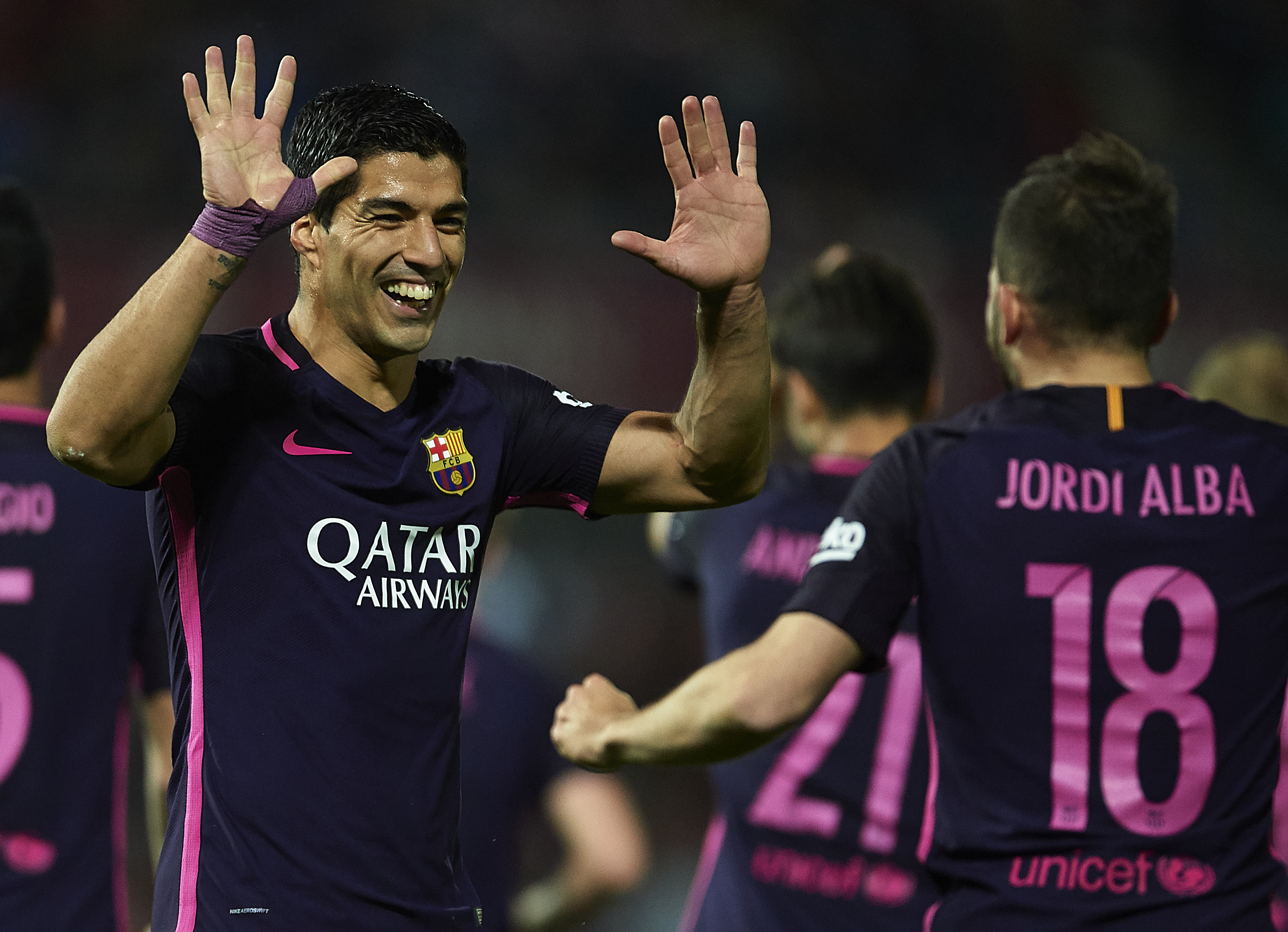 GRANADA, SPAIN - APRIL 02: Luis Suarez of FC Barcelona celebrates after scoring the first goal for FC Barcelona with his team mate Jordi Alba of FC Barcelona during the La Liga match between Granada CF v FC Barcelona at Estadio Nuevo Los Carmenes on April 02, 2017 in Granada, Spain. (Photo by Aitor Alcalde/Getty Images)