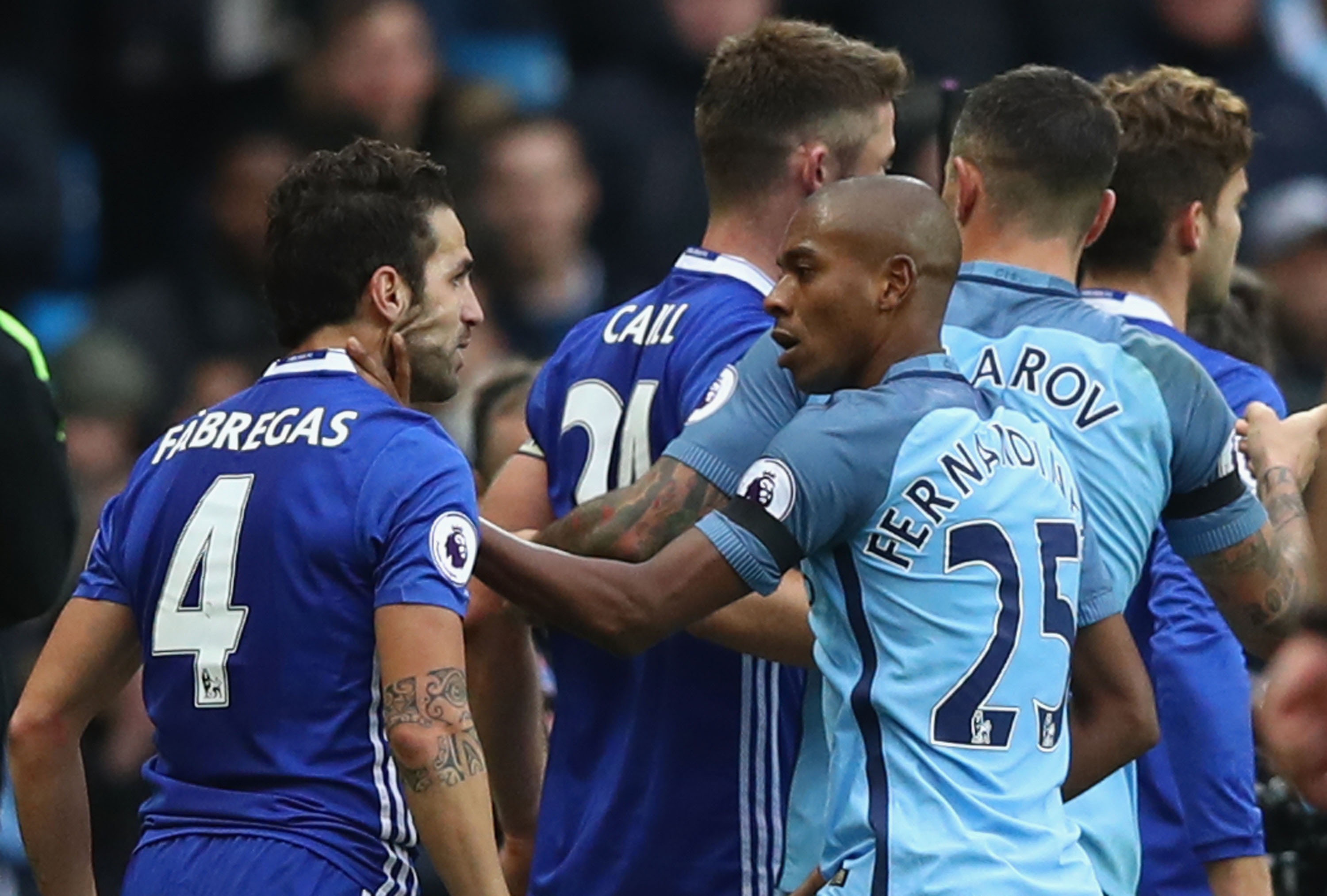 MANCHESTER, ENGLAND - DECEMBER 03: Cesc Fabregas of Chelsea and Fernandinho of Manchester City clash during the Premier League match between Manchester City and Chelsea at Etihad Stadium on December 3, 2016 in Manchester, England. (Photo by Clive Brunskill/Getty Images)