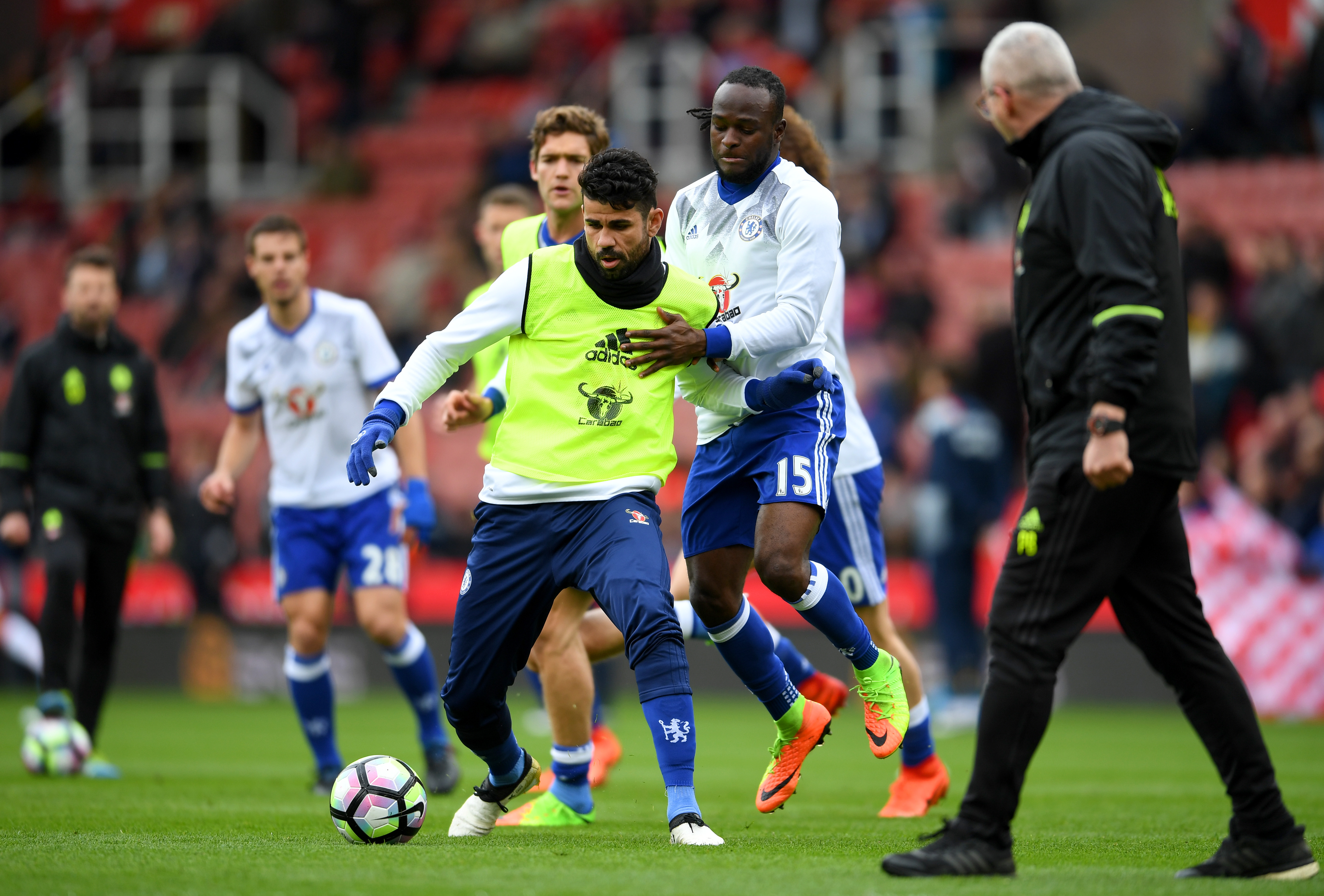 STOKE ON TRENT, ENGLAND - MARCH 18: Diego Costa of Chelsea (L) and Victor Moses of Chelsea (R) battle for possession during the warm up prior to the Premier League match between Stoke City and Chelsea at Bet365 Stadium on March 18, 2017 in Stoke on Trent, England. (Photo by Laurence Griffiths/Getty Images)