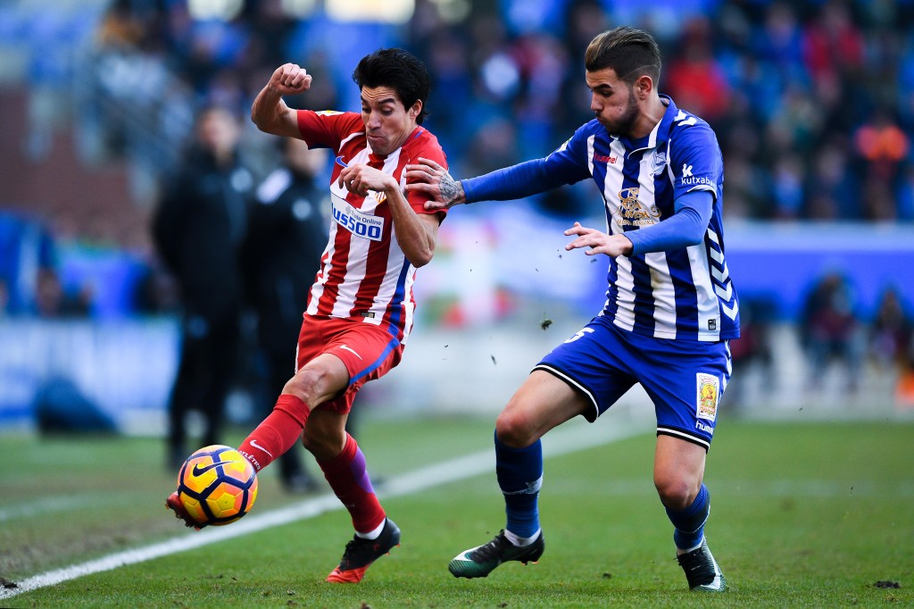 VITORIA-GASTEIZ, SPAIN - JANUARY 28: Nicolas Gaitan of Club Atletico de Madrid competes for the ball with Theo Hernandez of Deportivo Alaves during the La Liga match between Deportivo Alaves and Club Atletico de Madrid at Mendizorroza stadium on January 28, 2017 in Vitoria-Gasteiz, Spain. (Photo by David Ramos/Getty Images)