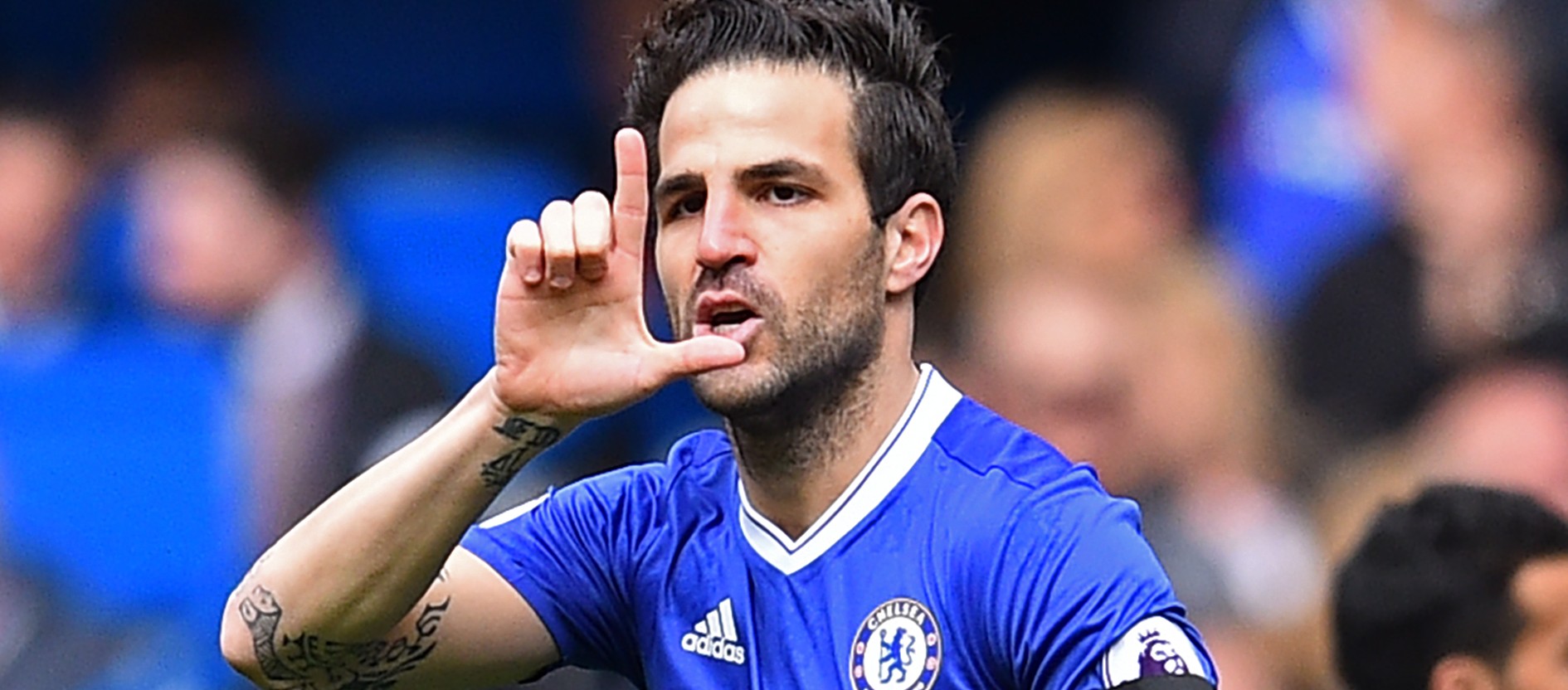 Chelsea's Spanish midfielder Cesc Fabregas celebrates after scoring the opening goal of the English Premier League football match between Chelsea and Crystal Palace at Stamford Bridge in London on April 1, 2017. / AFP PHOTO / Glyn KIRK / RESTRICTED TO EDITORIAL USE. No use with unauthorized audio, video, data, fixture lists, club/league logos or 'live' services. Online in-match use limited to 75 images, no video emulation. No use in betting, games or single club/league/player publications.  /         (Photo credit should read GLYN KIRK/AFP/Getty Images)