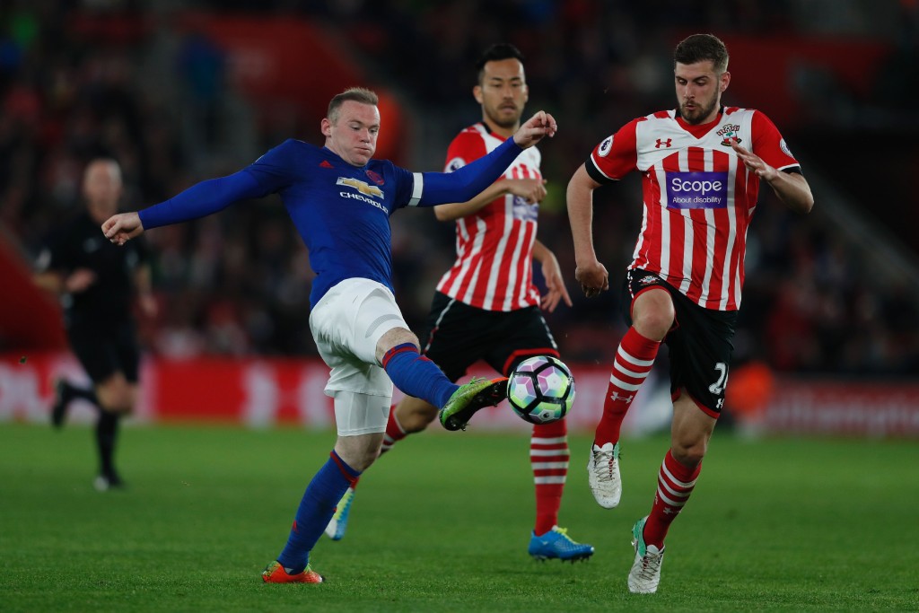 Manchester United's English striker Wayne Rooney (L) battles for the ball with Southampton's English defender Jack Stephens (R) during the English Premier League football match between Southampton and Manchester United at St Mary's Stadium in Southampton, southern England on May 17, 2017. / AFP PHOTO / Adrian DENNIS / RESTRICTED TO EDITORIAL USE. No use with unauthorized audio, video, data, fixture lists, club/league logos or 'live' services. Online in-match use limited to 75 images, no video emulation. No use in betting, games or single club/league/player publications. / (Photo credit should read ADRIAN DENNIS/AFP/Getty Images)