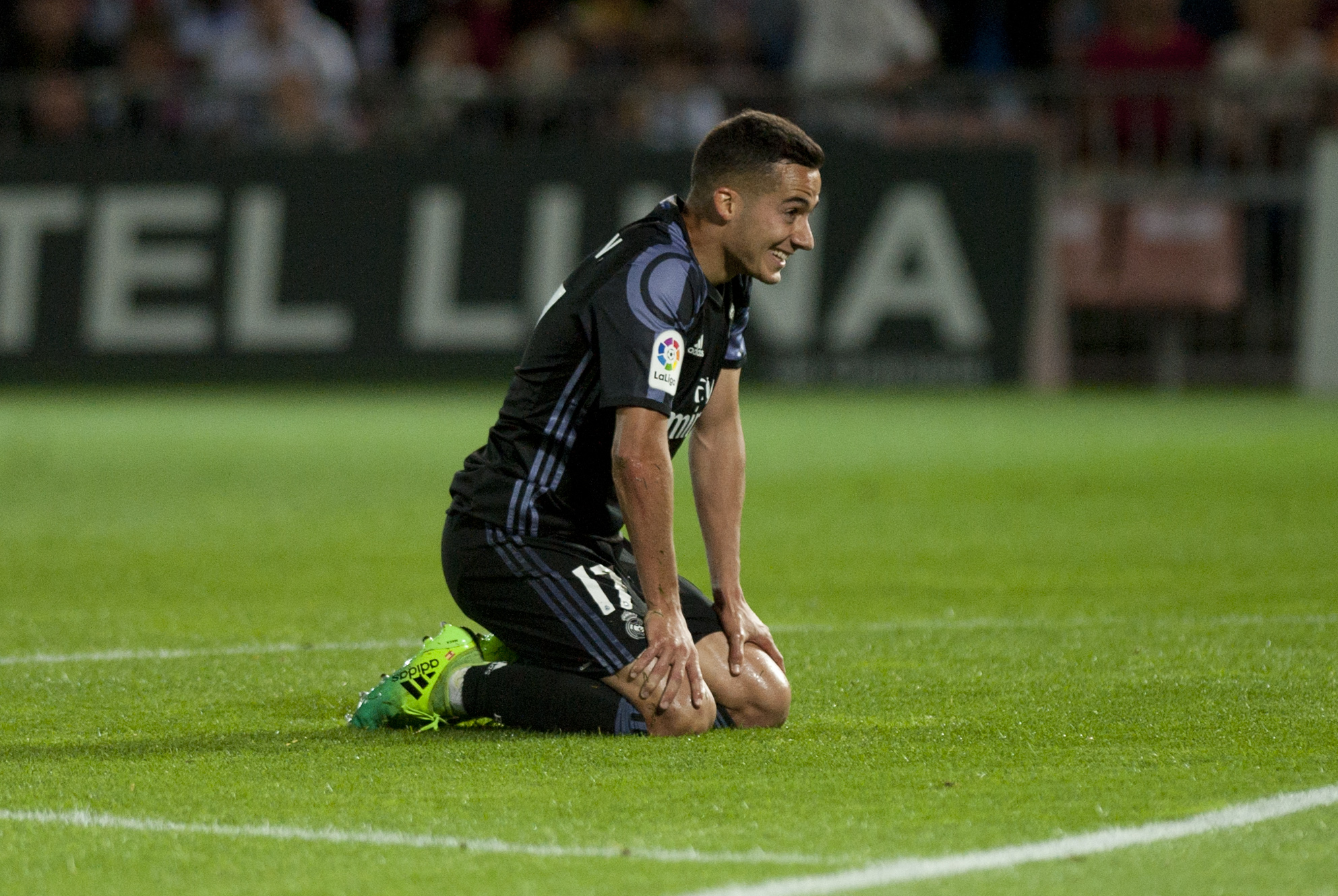 Real Madrid's forward Lucas Vazquez kneels on the field during the Spanish league football match Granada FC vs Real Madrid CF at Nuevo Los Carmenes stadium in Granada on May 6, 2017. / AFP PHOTO / SERGIO CAMACHO (Photo credit should read SERGIO CAMACHO/AFP/Getty Images)