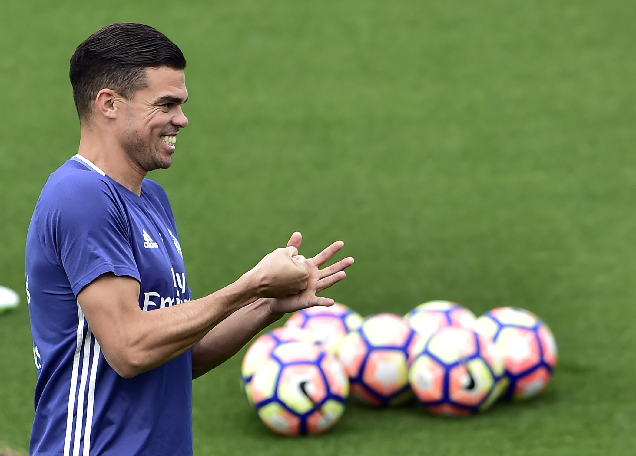Real Madrid's Portuguese defender Pepe smiles during a training session at Valdebebas training ground in Madrid on May 5, 2017, on the eve of the Spanish League match football match Granada CF vs Real Madrid CF. / AFP PHOTO / GERARD JULIEN        (Photo credit should read GERARD JULIEN/AFP/Getty Images)