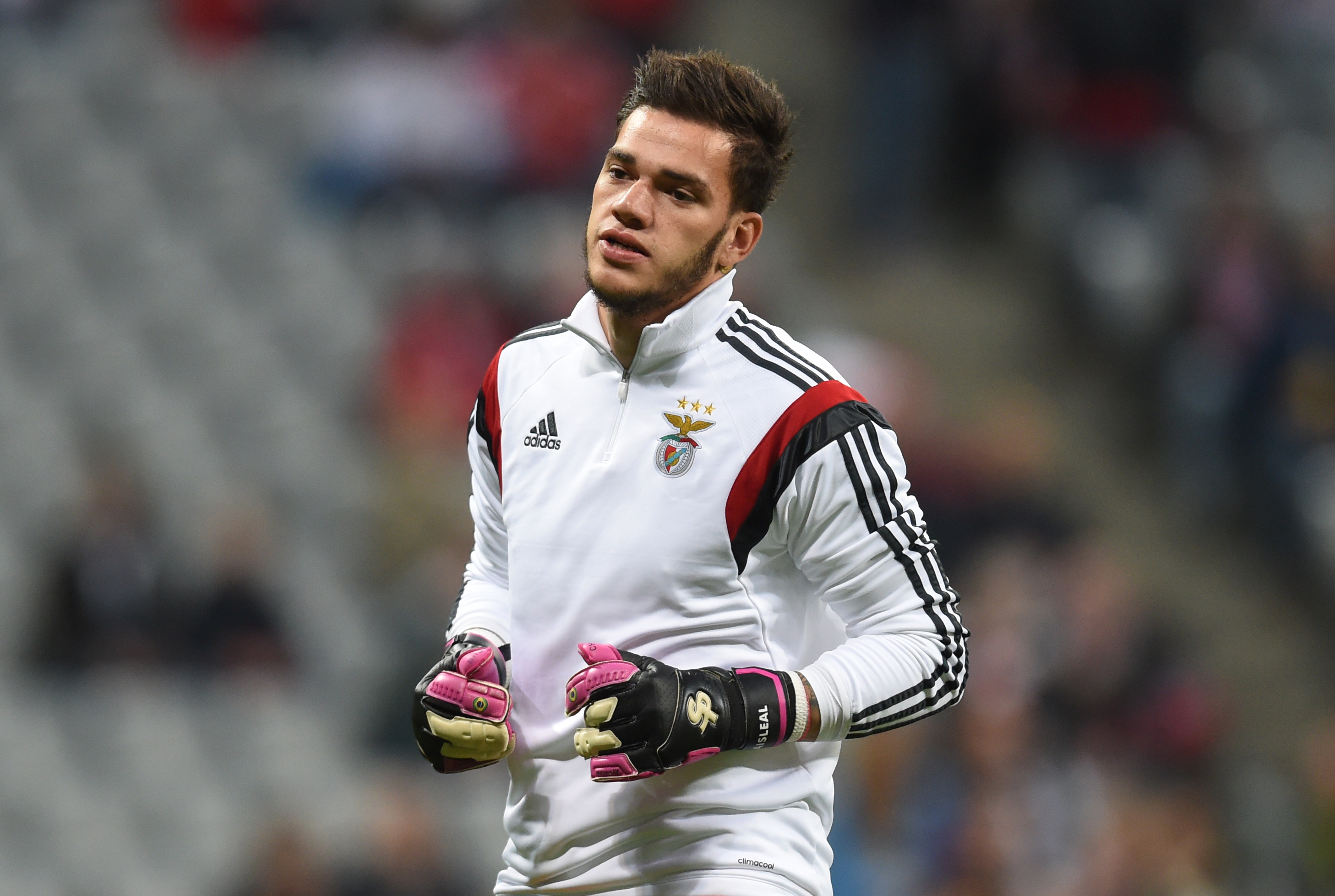 Benfica's Brazilian goalkeeper Ederson warms up prior  the Champions League quarterfinal, first-leg football match between Bayern Munich and SL Benfica in the stadium in Munich, southern Germany, on April 5, 2016. / AFP / CHRISTOF STACHE        (Photo credit should read CHRISTOF STACHE/AFP/Getty Images)