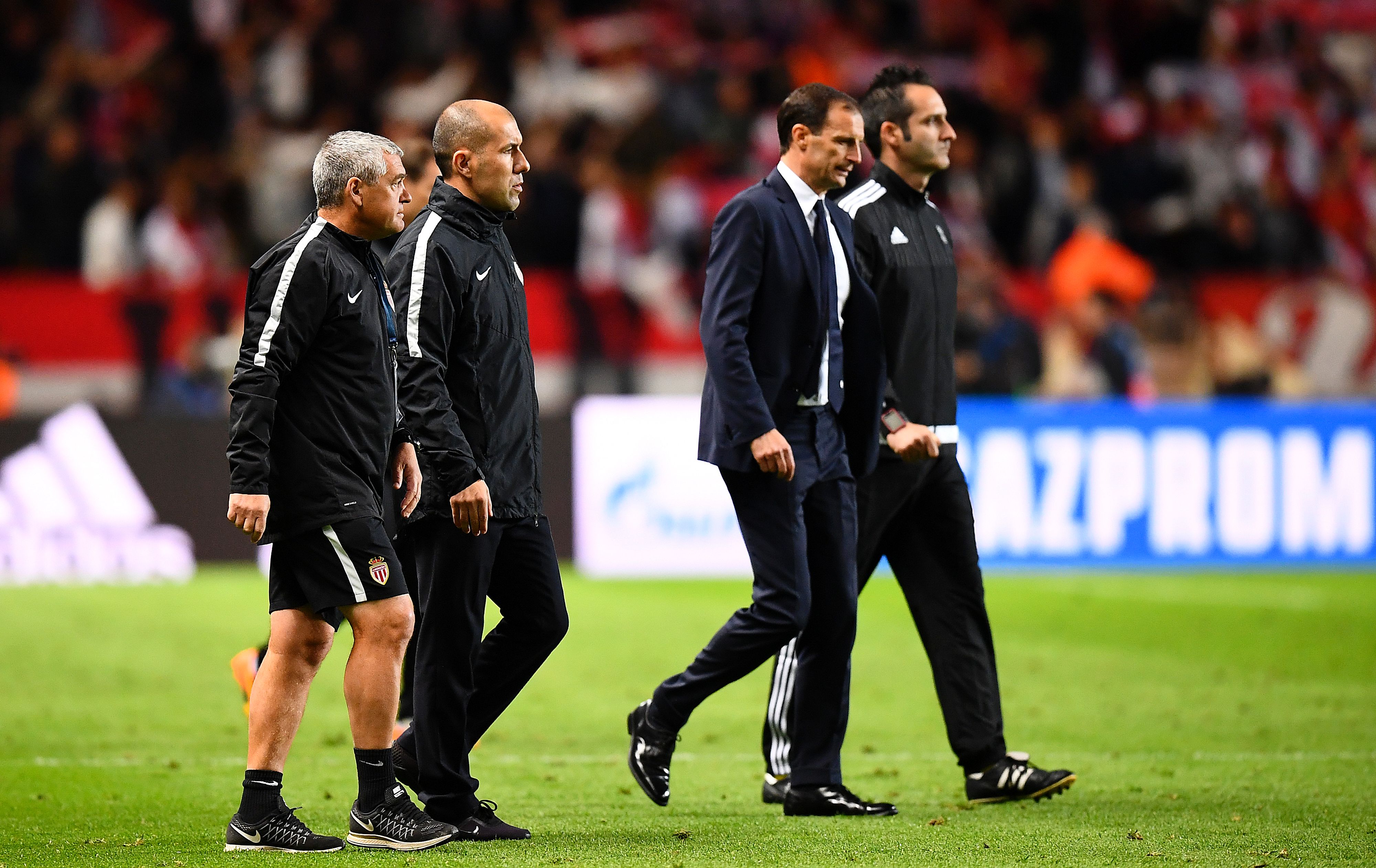 Juventus' Italian head coach Massimiliano Allegri (C) and Monaco's Portuguese coach Leonardo Jardim (L) leave the pitch during the UEFA Champions League semi-final first leg football match between Monaco and Juventus at Stade Louis II Stadium in Monaco on May 3, 2017. / AFP PHOTO / FRANCK FIFE (Photo credit should read FRANCK FIFE/AFP/Getty Images)