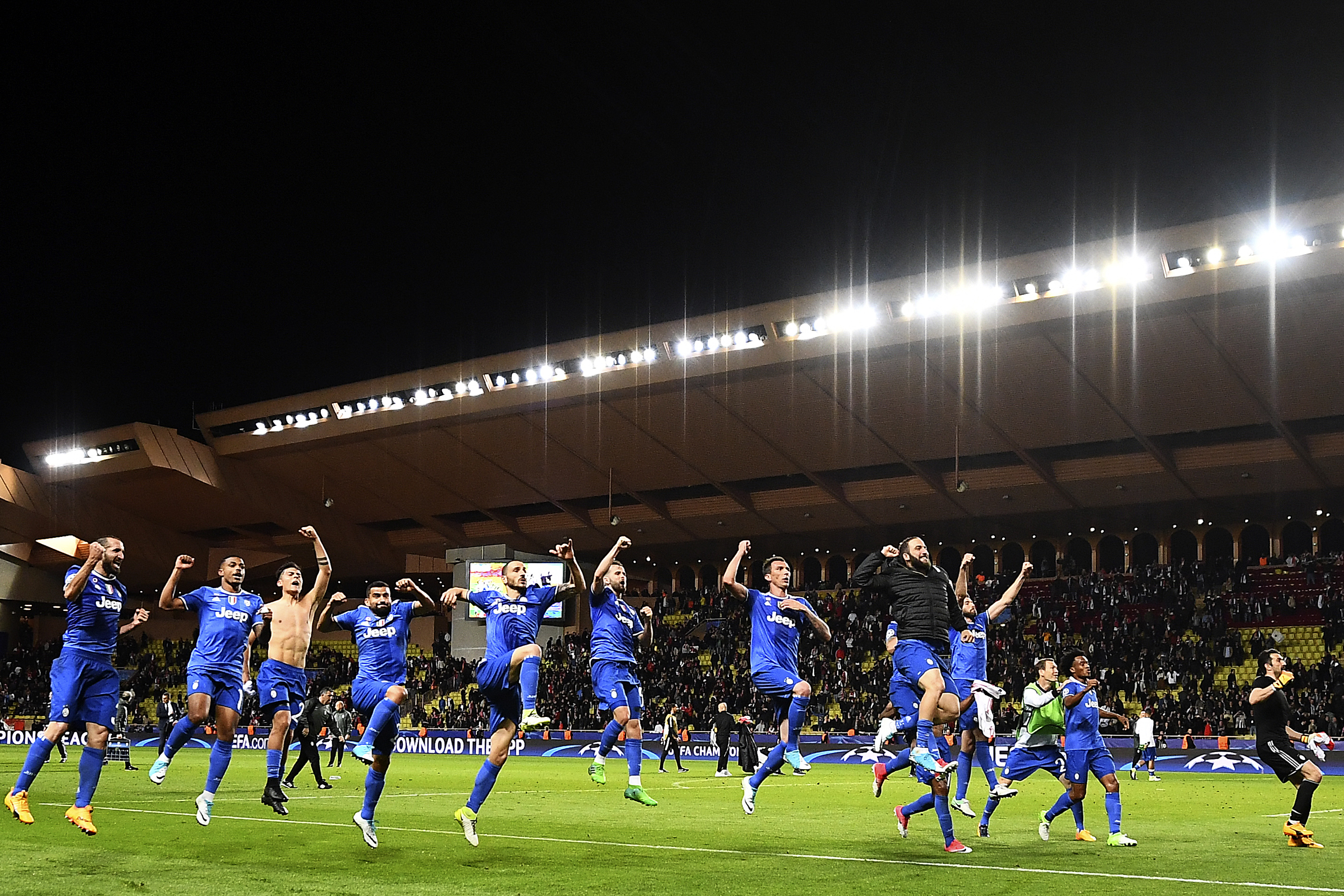 Juventus' forward from Argentina Gonzalo Higuain (black jacket) who scored 2 goals celebrates with team mates their 2-0 win over Monaco during the UEFA Champions League semi-final first leg football match Monaco vs Juventus at the Stade Louis II stadium in Monaco on May 3, 2017. / AFP PHOTO / FRANCK FIFE (Photo credit should read FRANCK FIFE/AFP/Getty Images)