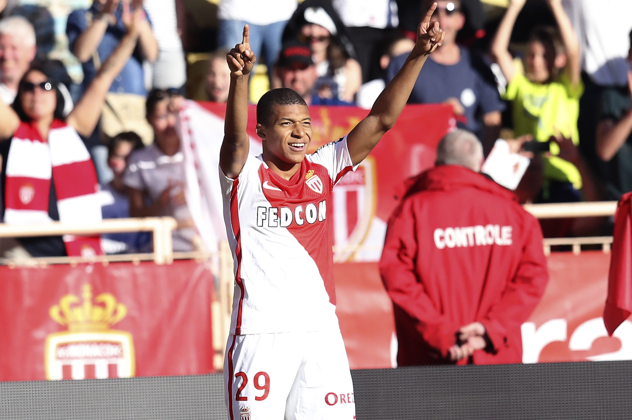 Monaco's French forward Kylian Mbappe Lottin celebrates after scoring a goal during the French L1 football match Monaco (ASM) vs Toulouse (TFC) on April 29, 2017 at the "Louis II Stadium" in Monaco. / AFP PHOTO / VALERY HACHE (Photo credit should read VALERY HACHE/AFP/Getty Images)