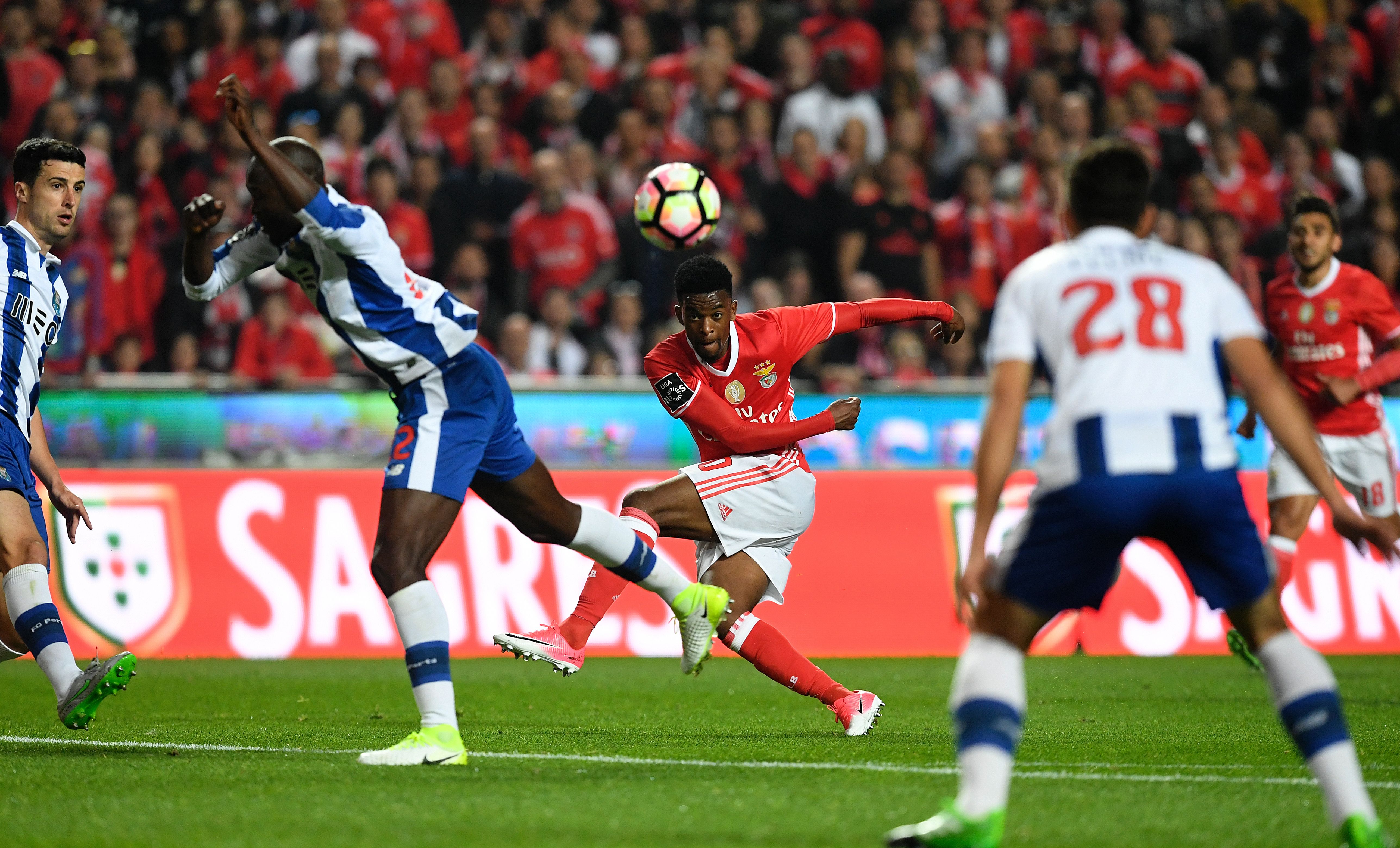 Benfica's defender Nelson Semedo (C) kicks the ball during the Portuguese league football match SL Benfica vs FC Porto at the Luz stadium in Lisbon on April 1, 2017. / AFP PHOTO / FRANCISCO LEONG (Photo credit should read FRANCISCO LEONG/AFP/Getty Images)
