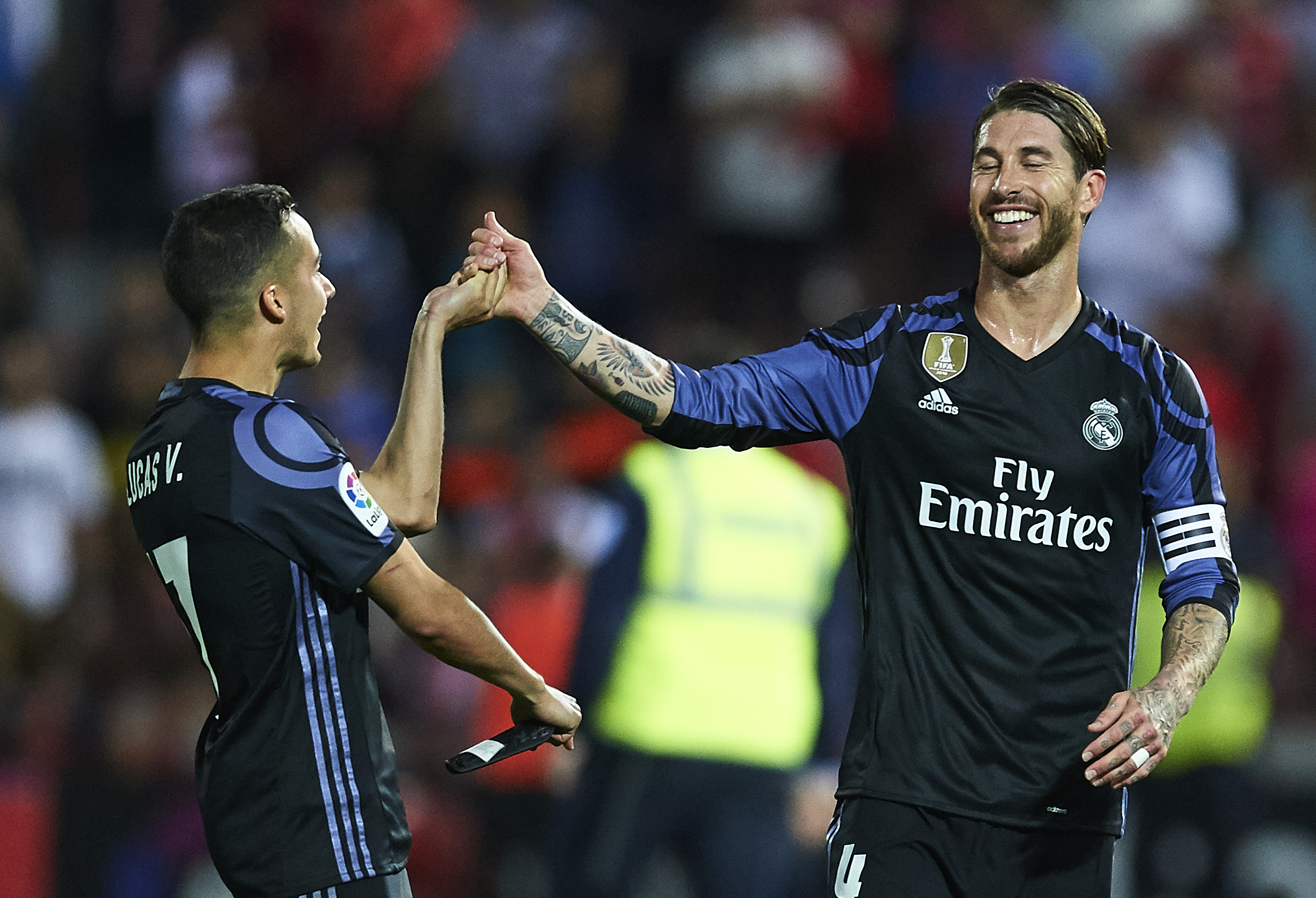 GRANADA, SPAIN - MAY 06: Sergio Ramos of Real Madrid CF (R) celebrates after wining the match with Lucas Vazquez of Real Madrid CF (L) during the La Liga match between Granada CF v Real Madrid CF at Estadio Nuevo Los Carmenes on May 6, 2017 in Granada, Spain. (Photo by Aitor Alcalde/Getty Images)