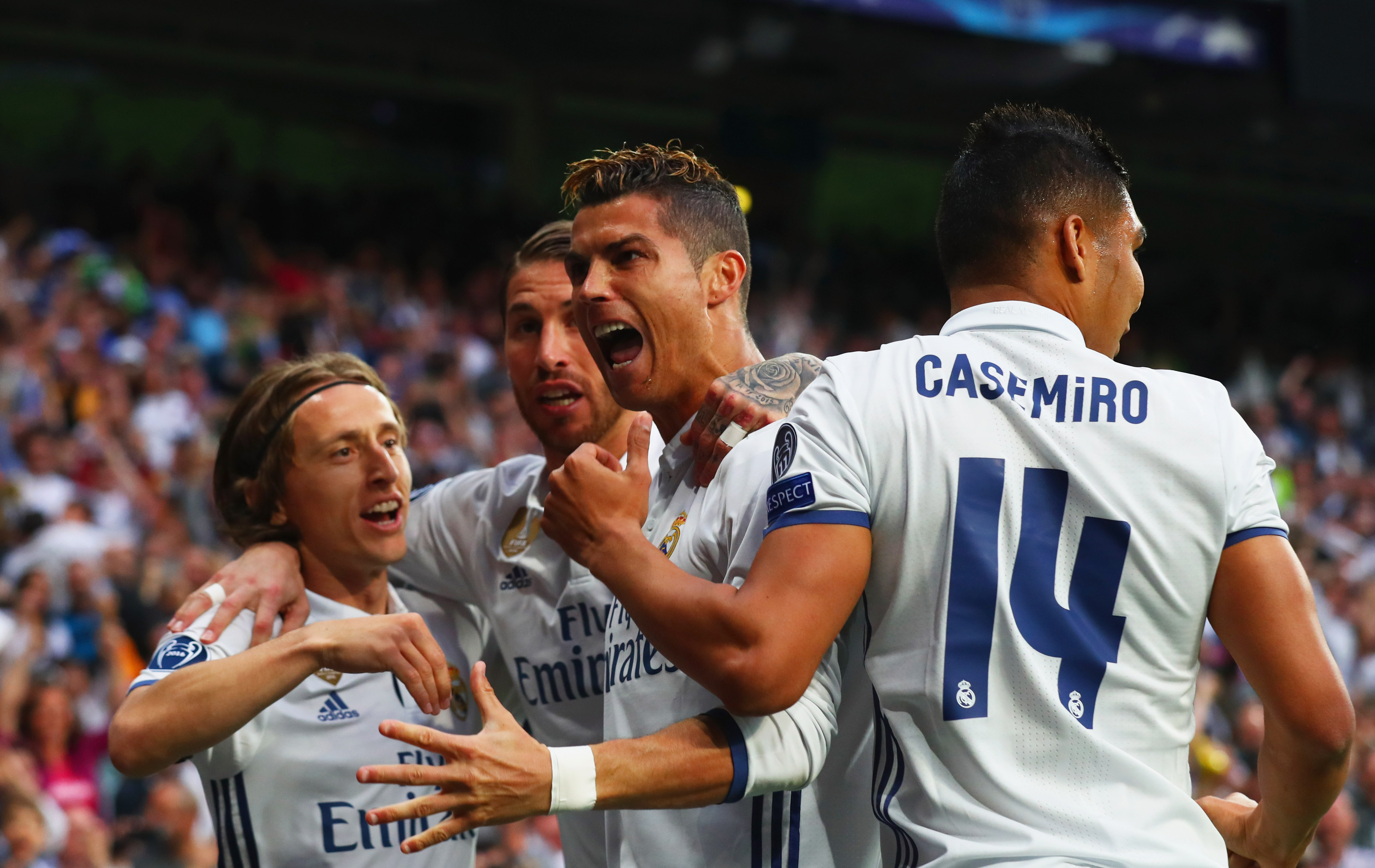 MADRID, SPAIN - MAY 02: Cristiano Ronaldo of Real Madrid (2R) celebrates as he scores their first goal with team mates during the UEFA Champions League semi final first leg match between Real Madrid CF and Club Atletico de Madrid at Estadio Santiago Bernabeu on May 2, 2017 in Madrid, Spain. (Photo by Clive Rose/Getty Images)