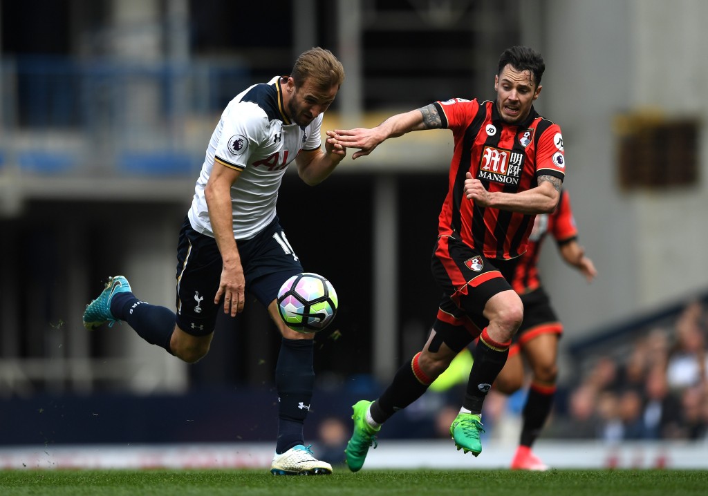 LONDON, ENGLAND - APRIL 15: Harry Kane of Tottenham Hotspur (L) and Adam Smith of AFC Bournemouth (R) battle for possession during the Premier League match between Tottenham Hotspur and AFC Bournemouth at White Hart Lane on April 15, 2017 in London, England. (Photo by Shaun Botterill/Getty Images)