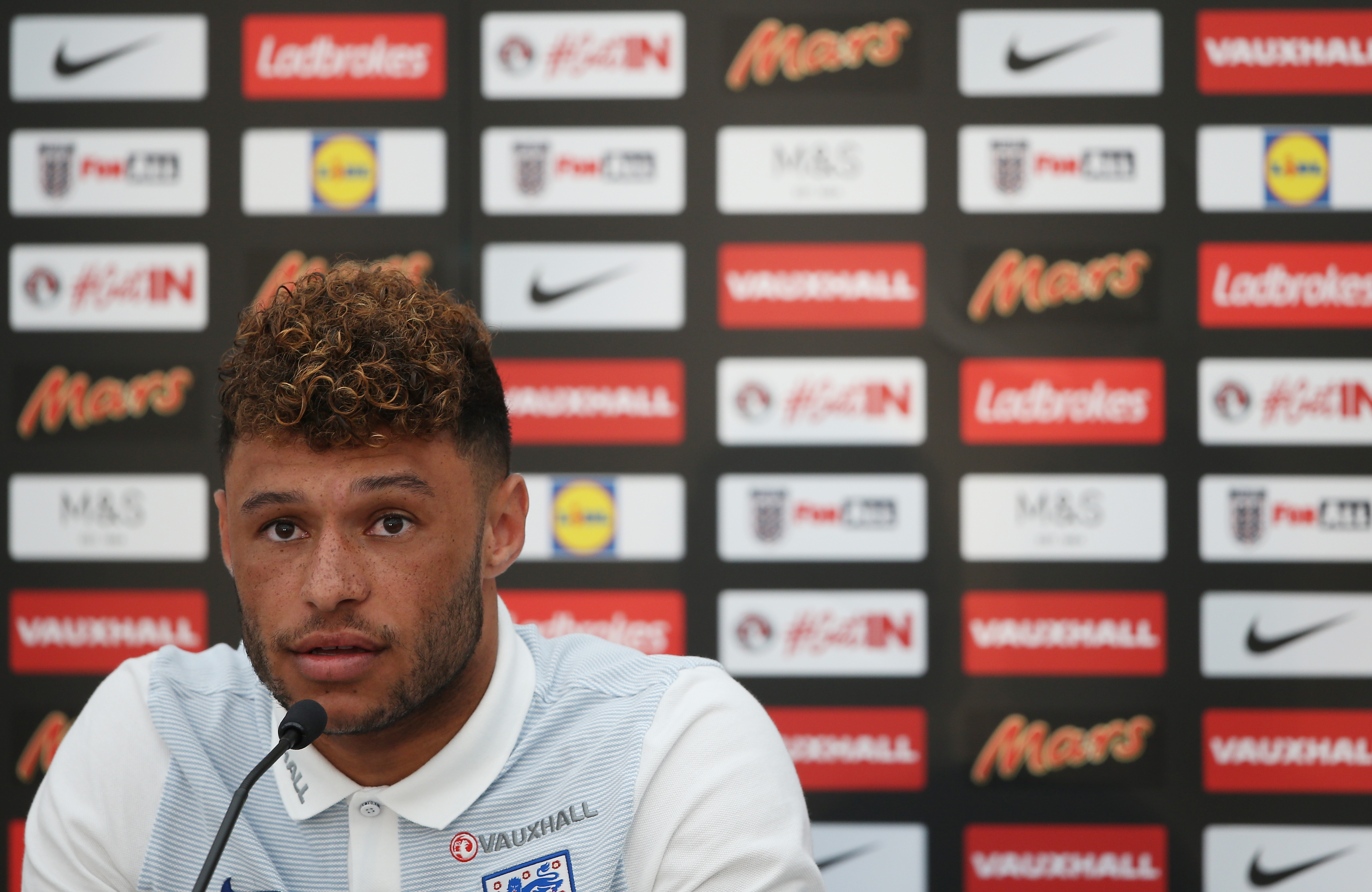 CROISSY-SUR-SEINE, FRANCE - JUNE 12: Alex Oxlade-Chamberlain speaks to the media during the England press conference at the Chemin De Ronde Stadium on June 12, 2017 in Croissy-sur-Seine, France. (Photo by Alex Pantling/Getty Images)